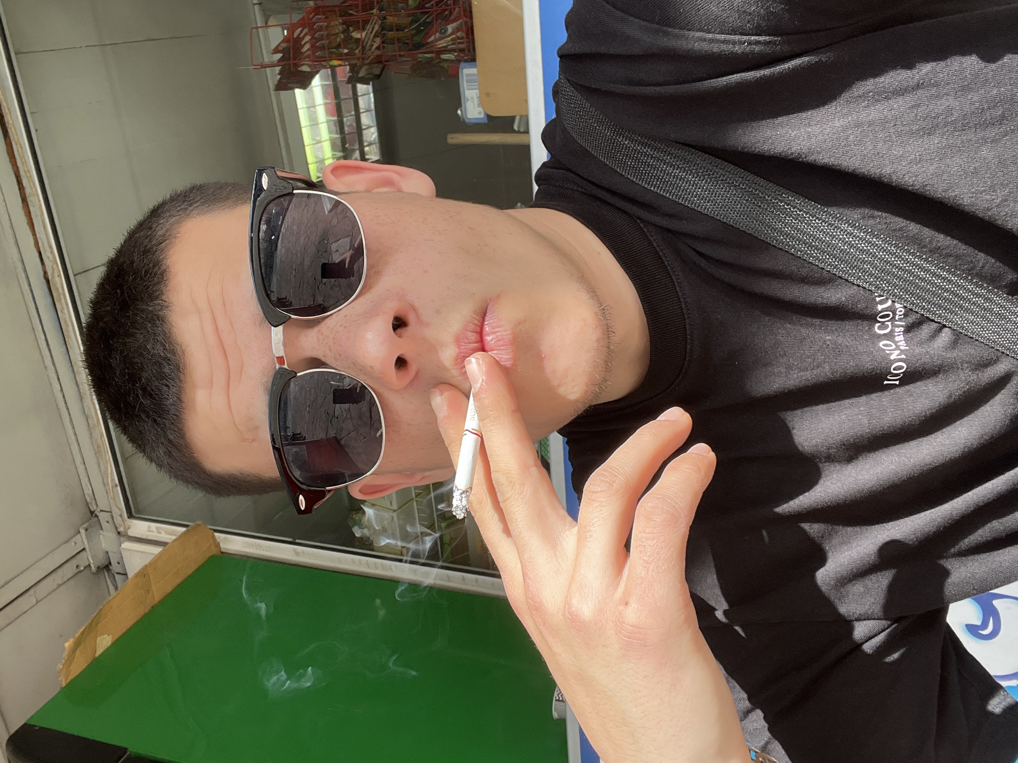 Man smoking cigarette captured in multiple photos in Sopot