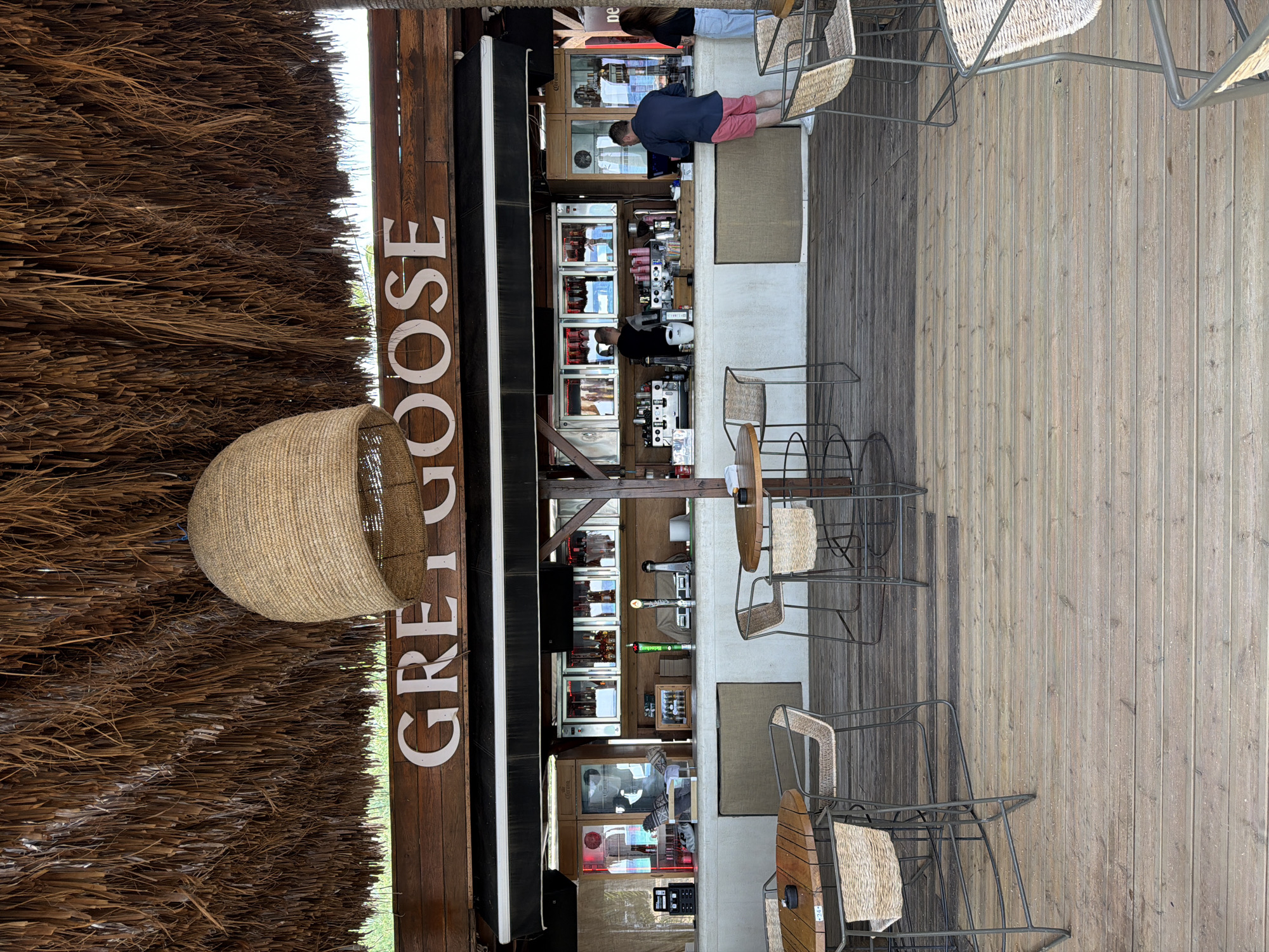 Thatched beach bar and loungers in Nea Peramos, Greece