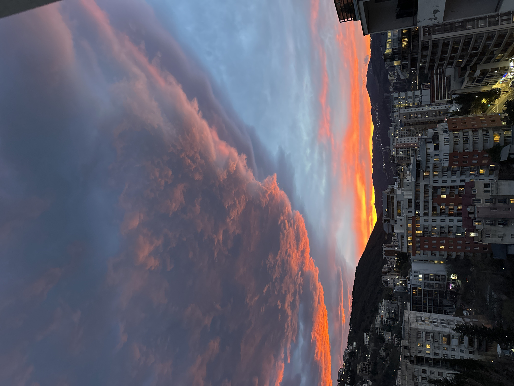 Dramatic sunset illuminates Tbilisi skyline with fiery colors