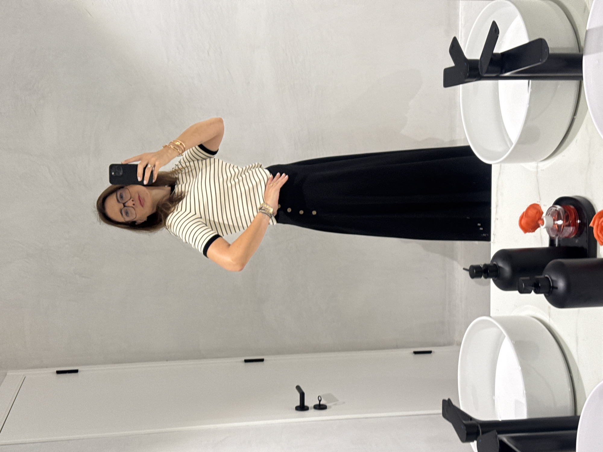 Woman takes bathroom selfie in Torres Vedras, Portugal