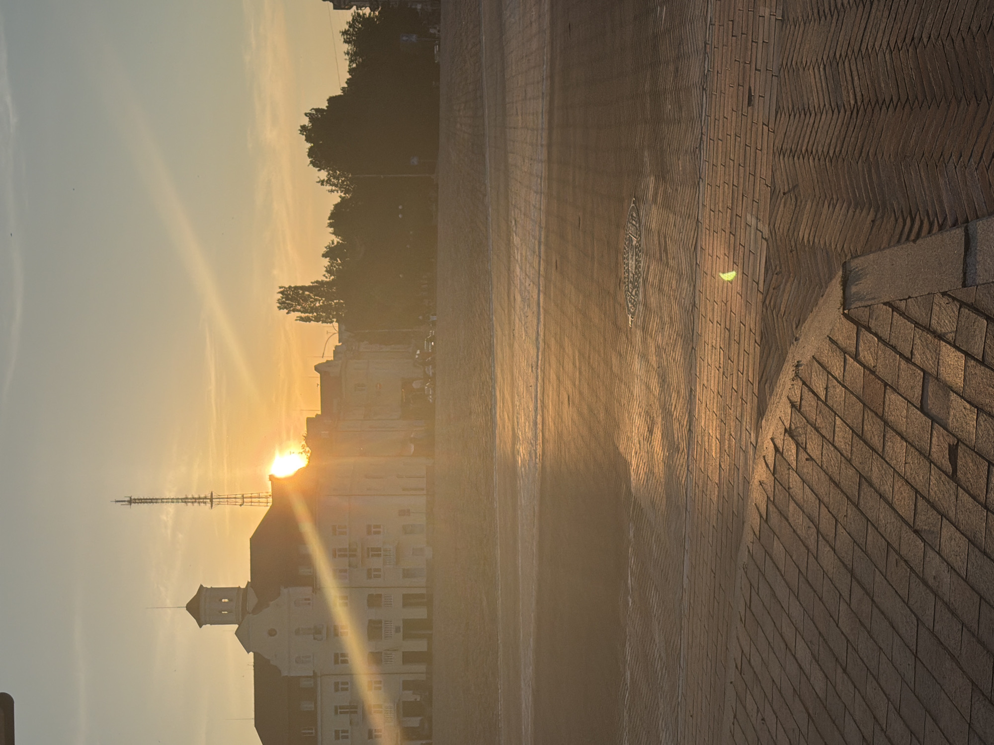City skyline and radio tower at golden hour