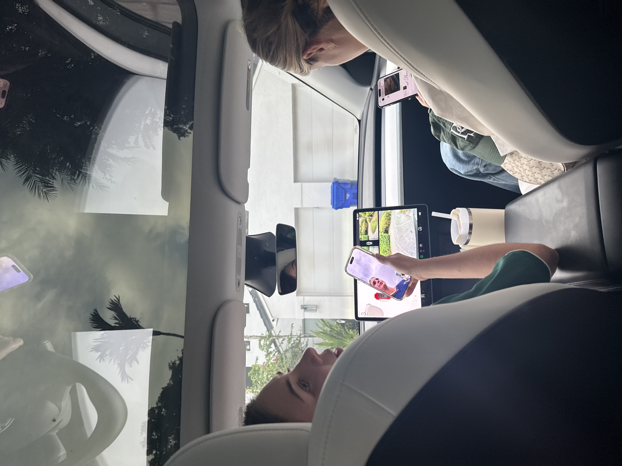 Passengers inside a Tesla, Miami night