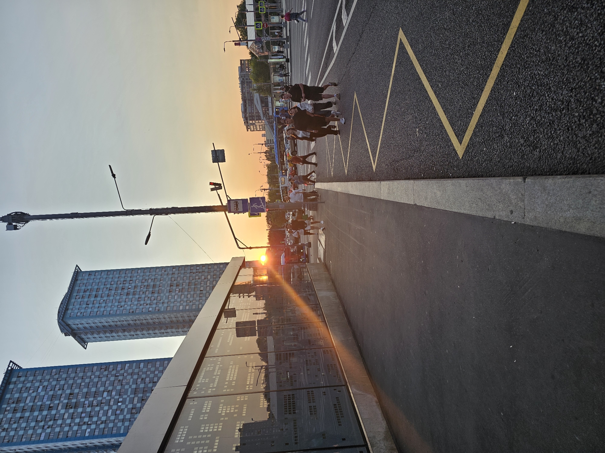 Dusk settles over a busy Khimki street corner