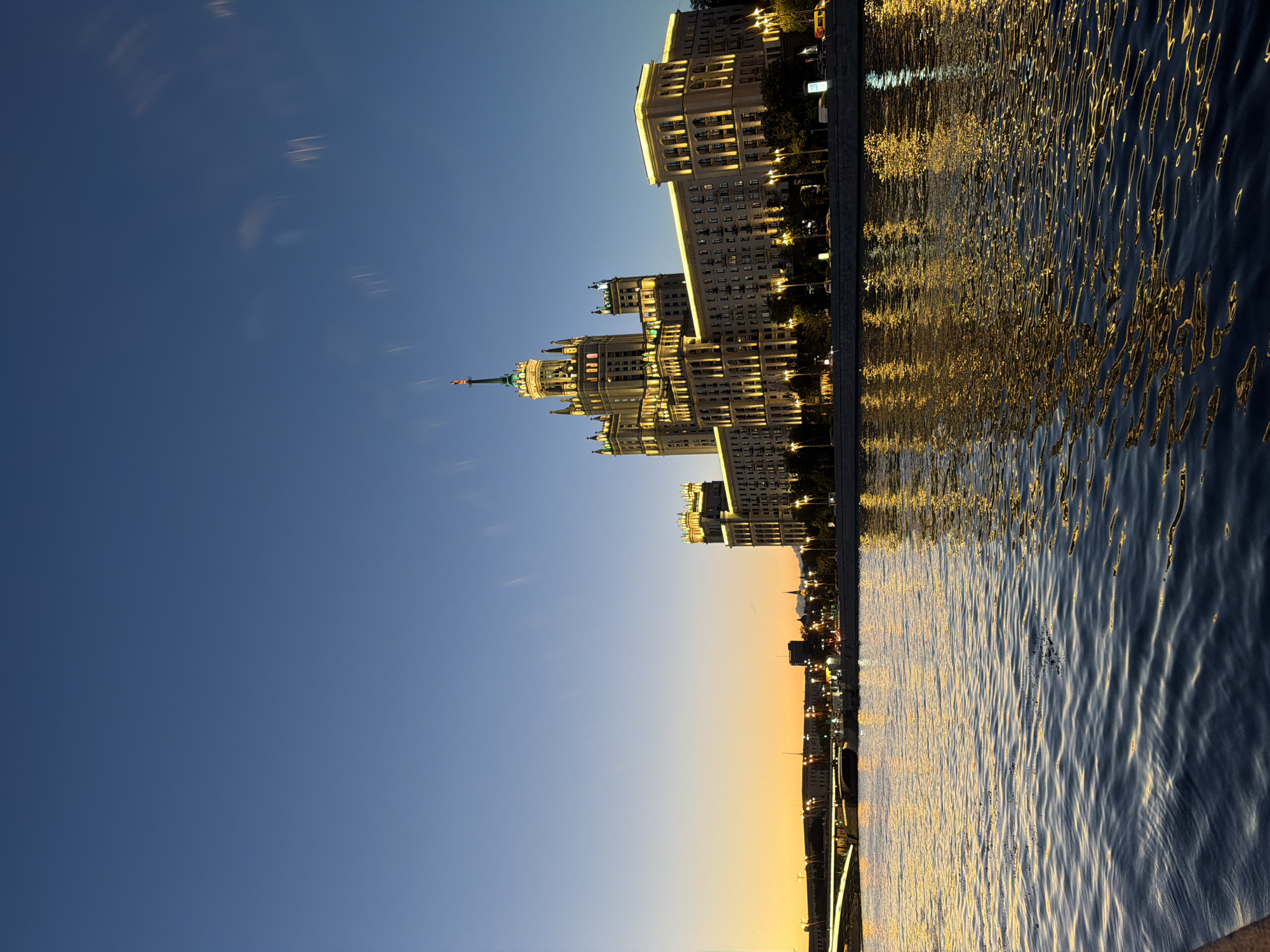 Moscow's Kotelnicheskaya tower at twilight along the Moskva River