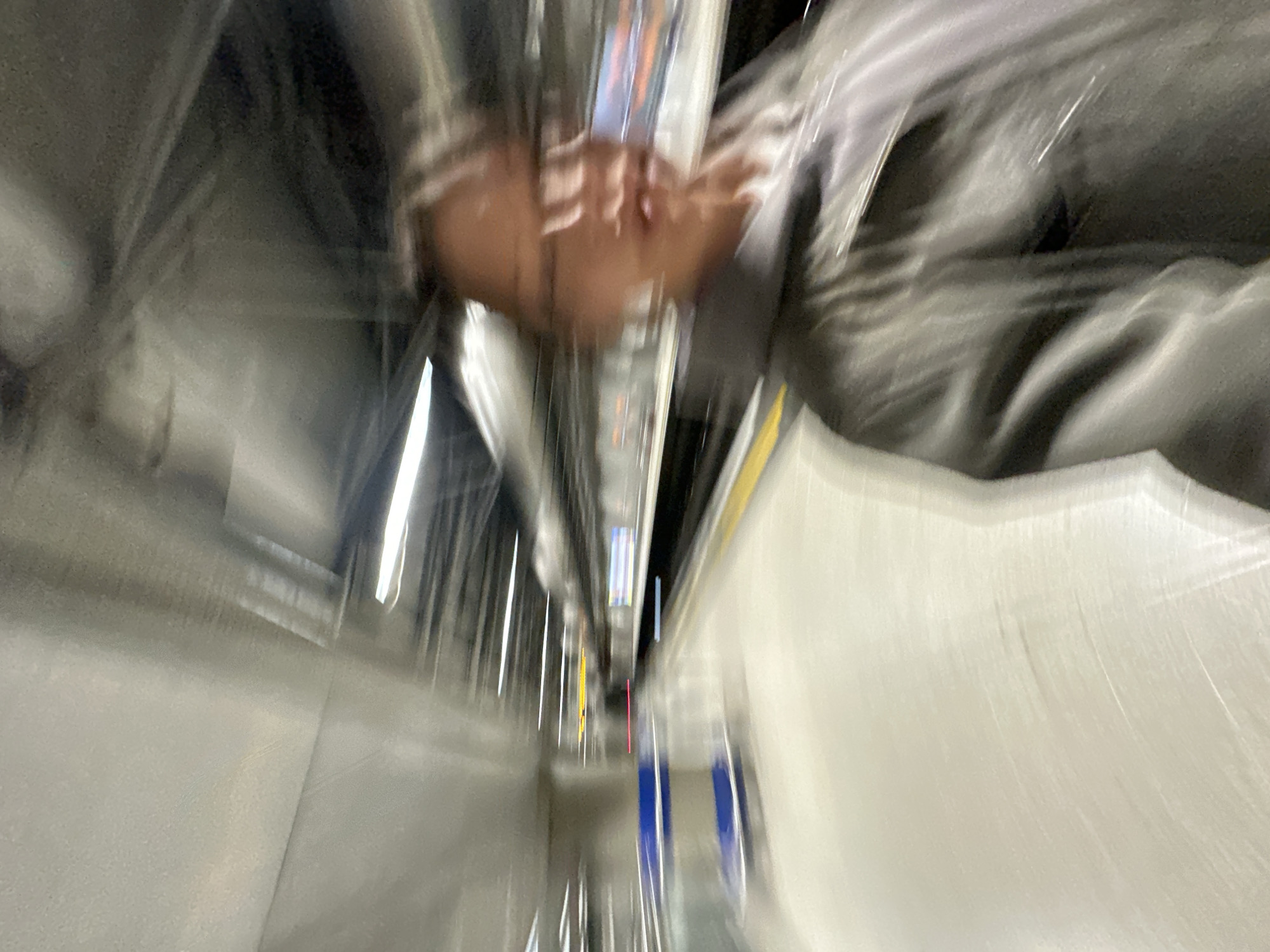 Woman styles hair, takes selfie on London tube platform