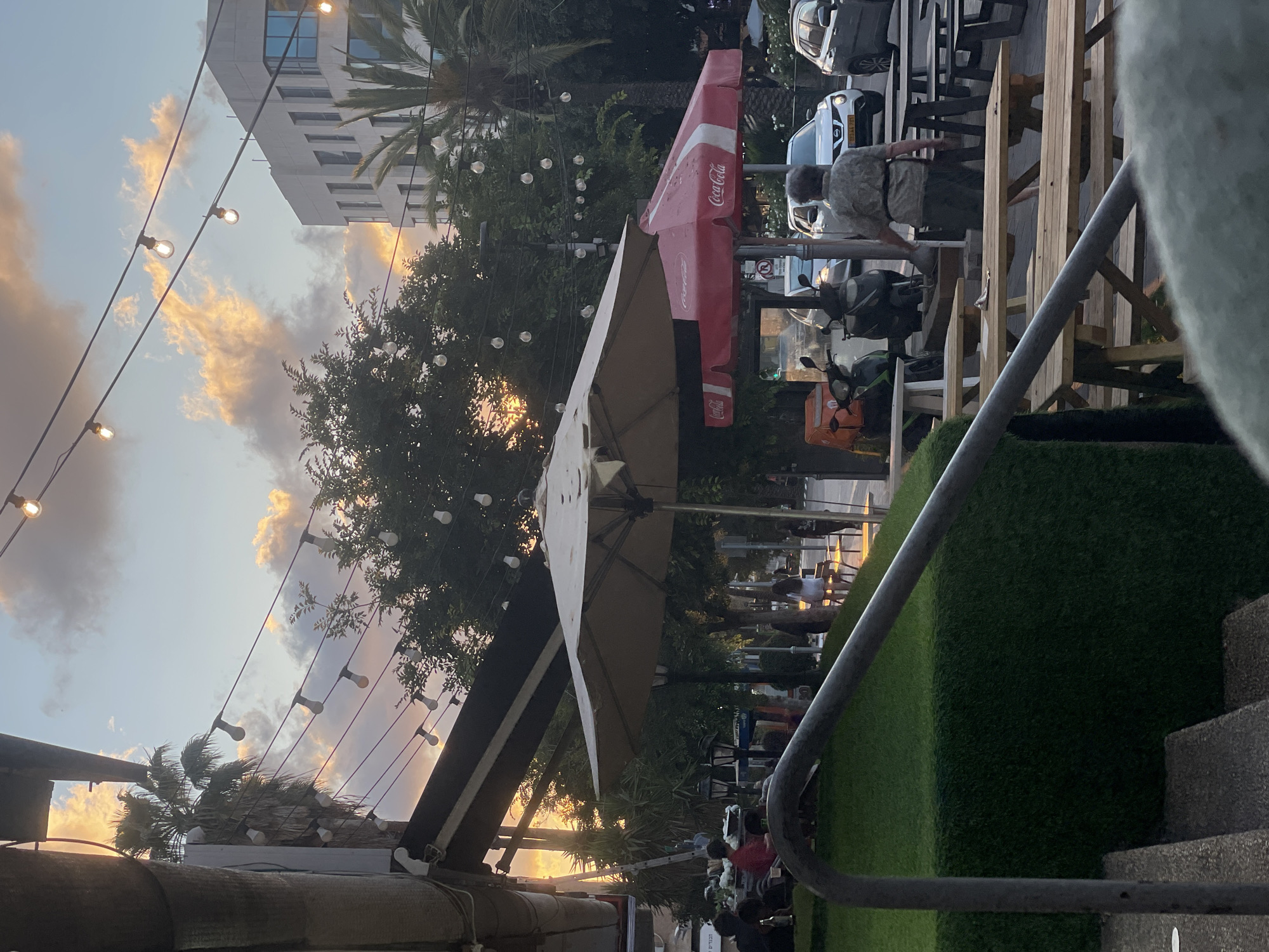 Sunset dining scene captured in Raanana, Israel restaurant district