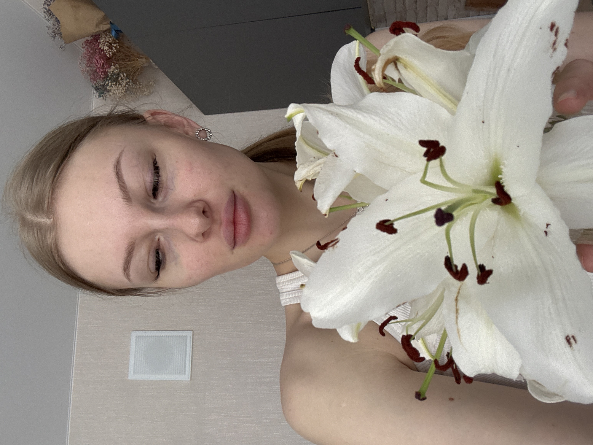Woman photographed with white lilies in Perm morning session