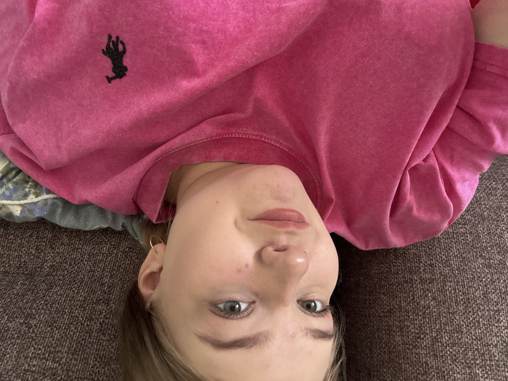 Woman takes indoor selfies in pink shirt, Foki Russia