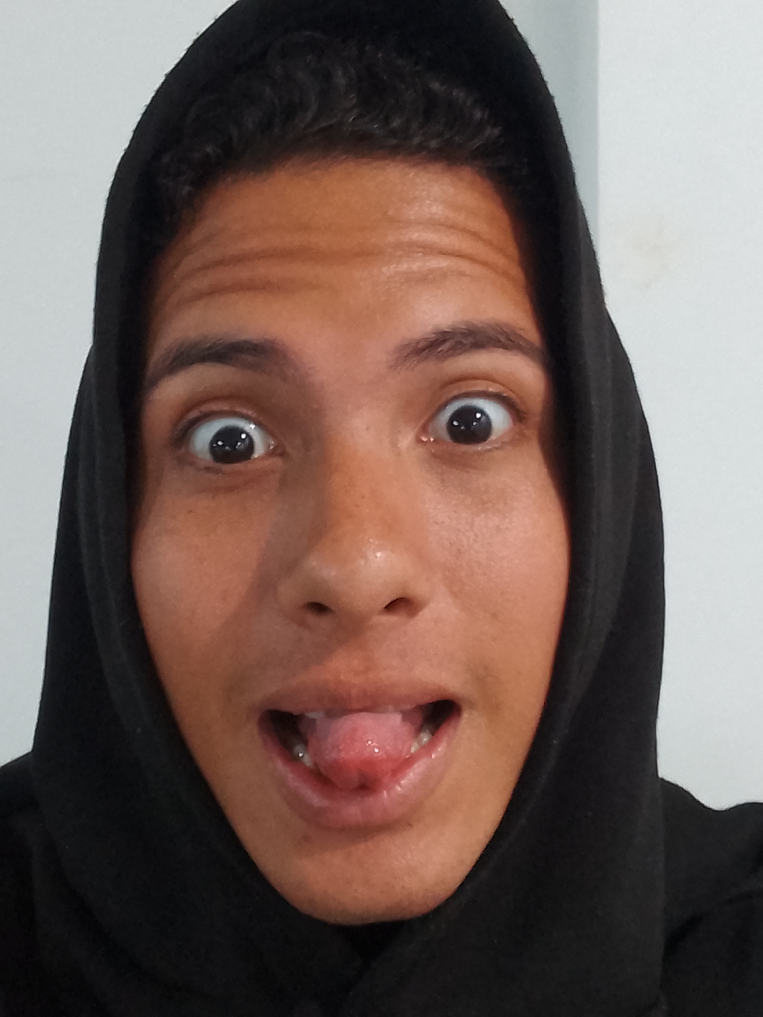 Young man documents evening at Porlamar resort with selfies