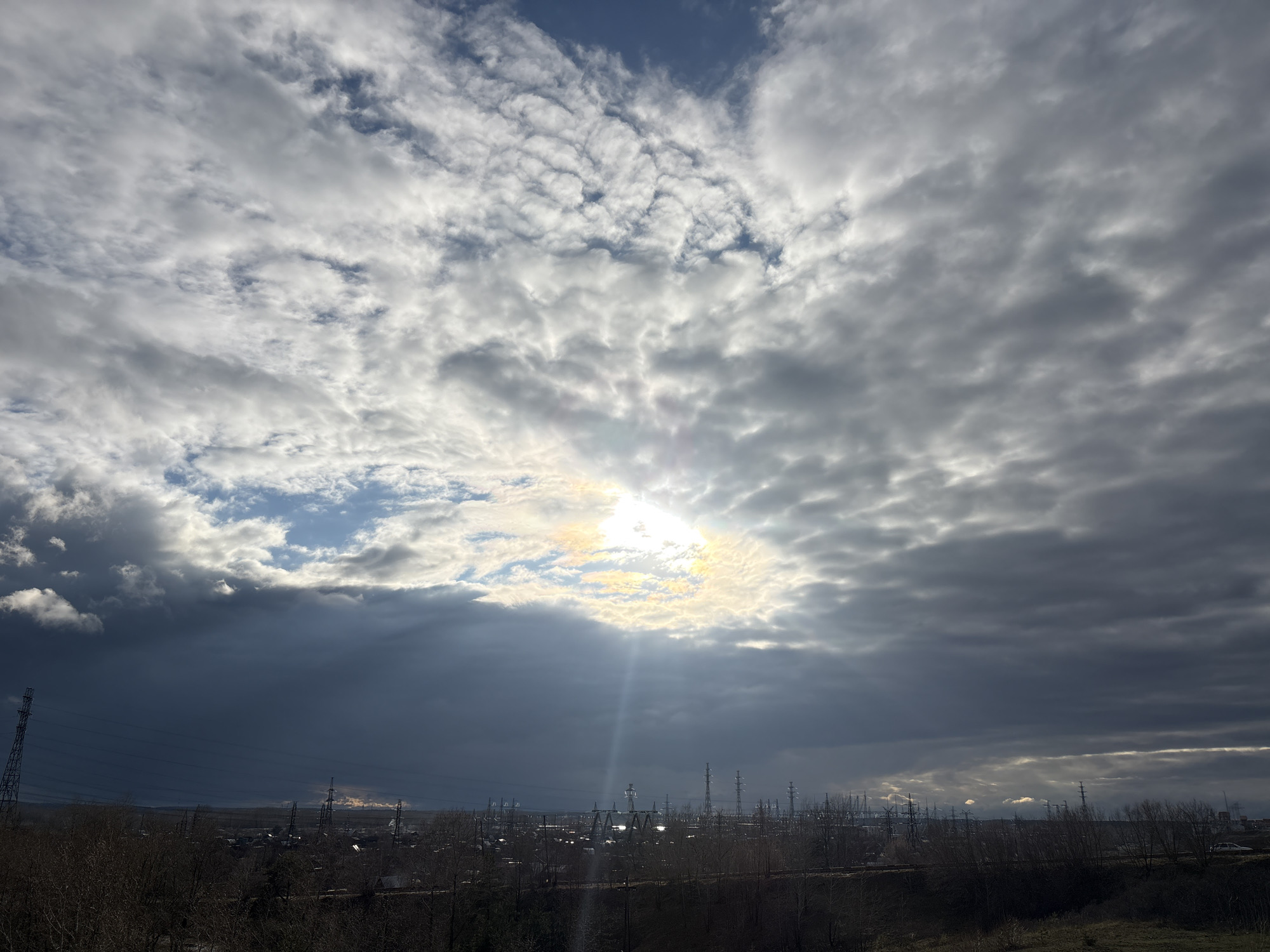 Dramatic skies captured over Chaikovsky industrial landscape and Kama River
