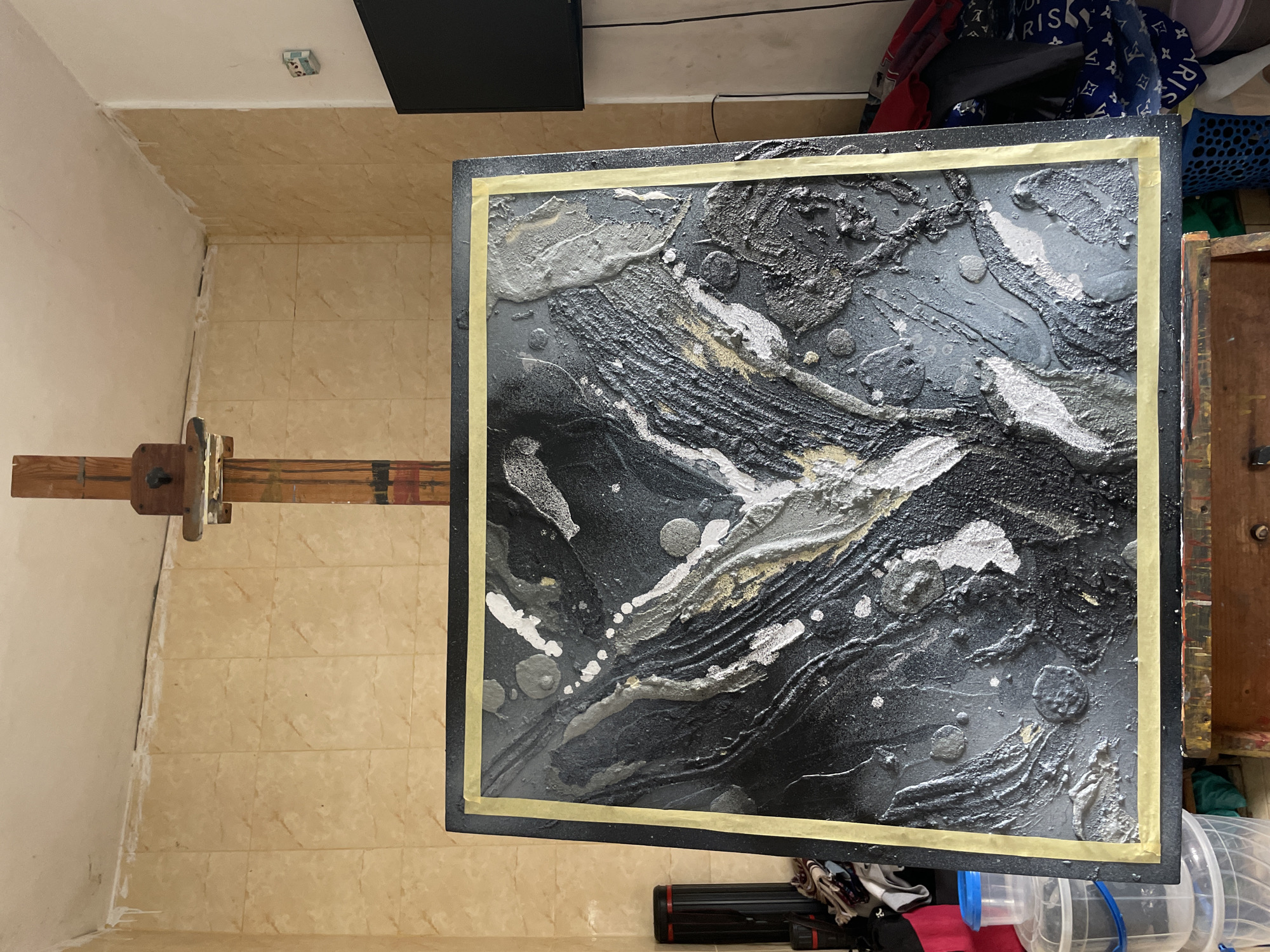 Abstract painting displayed on easel in Ado, Nigeria