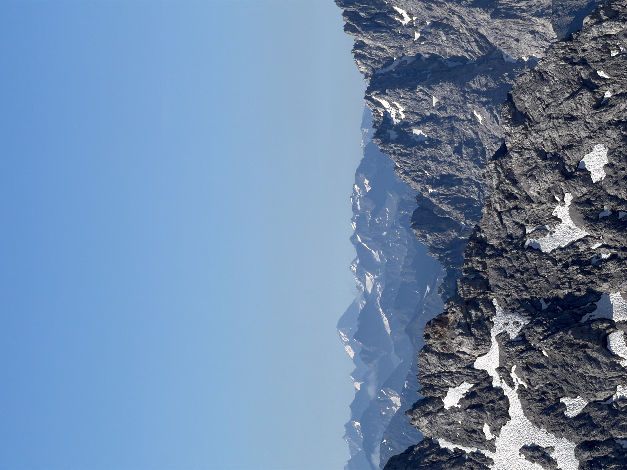 Snow-dusted alpine rocks under clear skies near Garmisch-Partenkirchen
