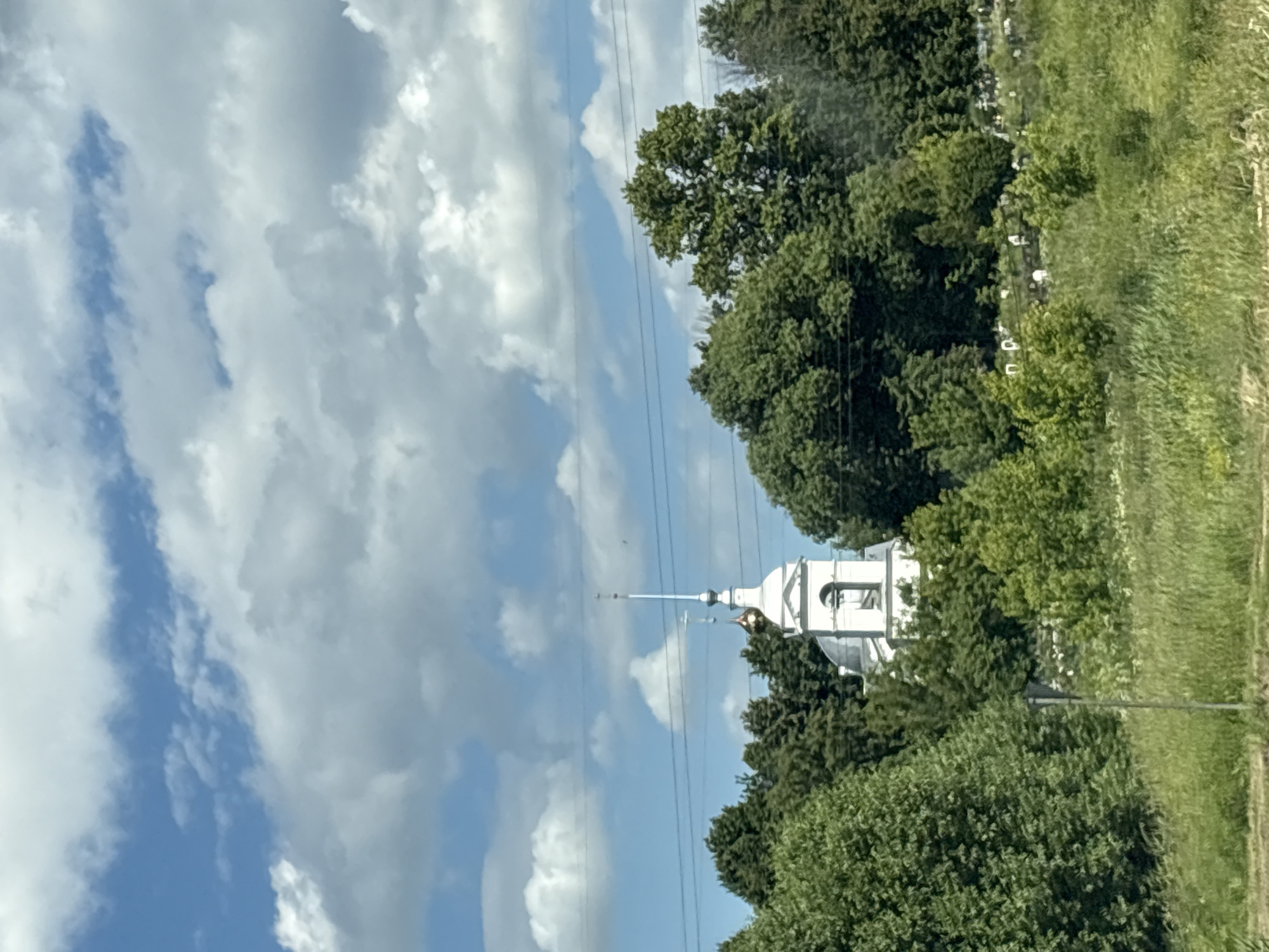 Orthodox church and village signage in Petrovskoye, Yaroslavl Oblast