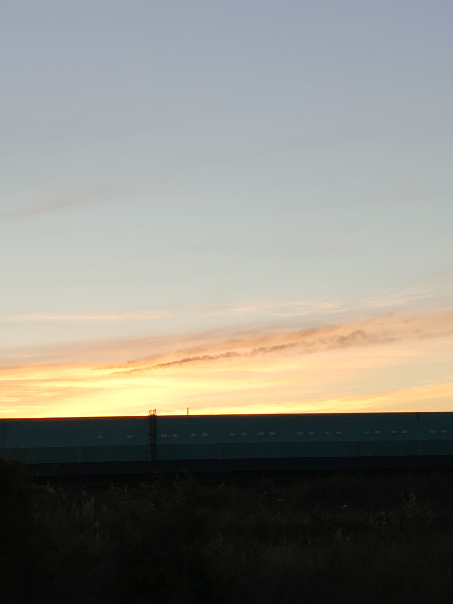 Warehouse and loading dock activity at dawn or dusk