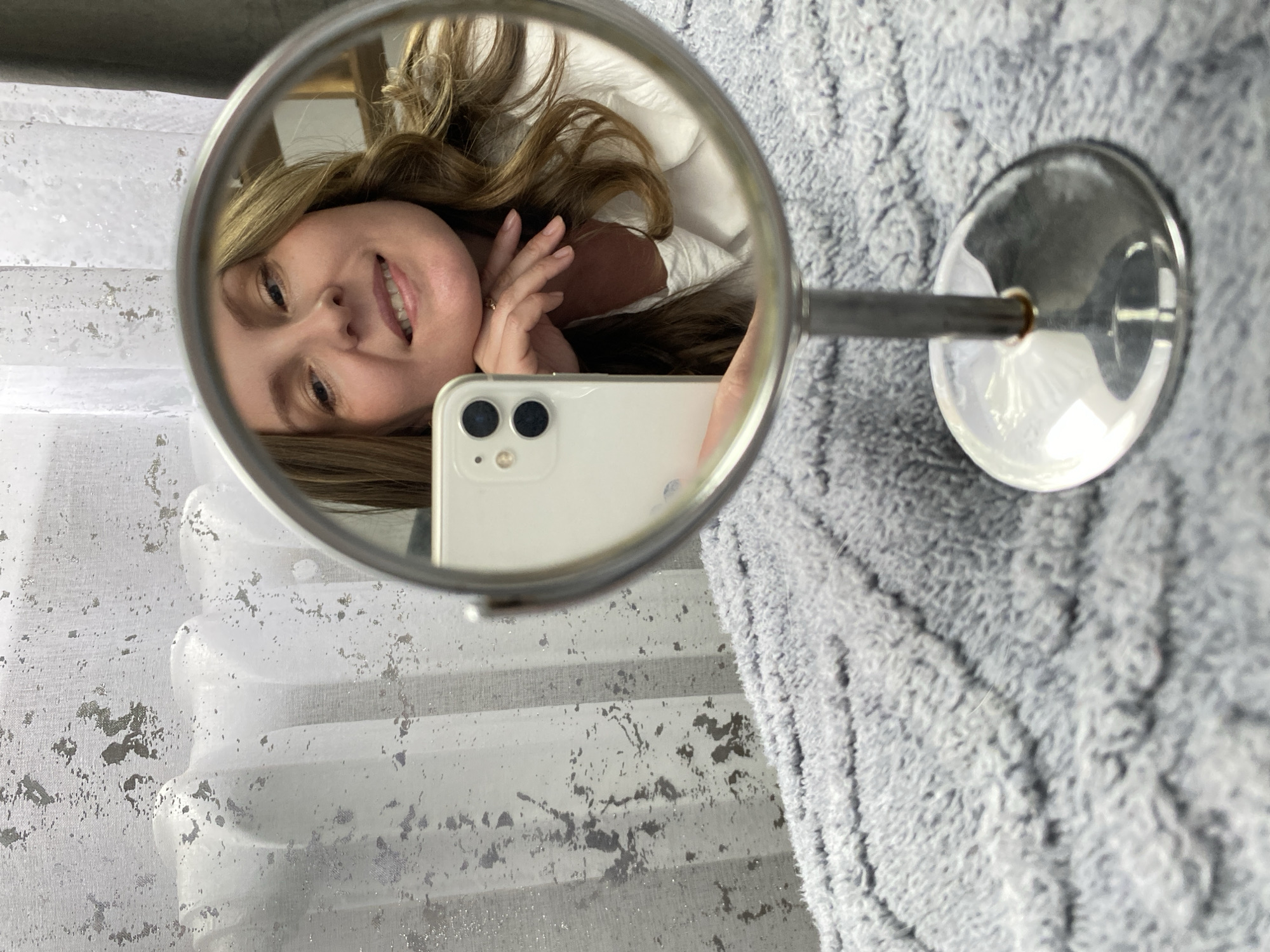 Woman takes mirror selfies in Noviy, Russia morning routine