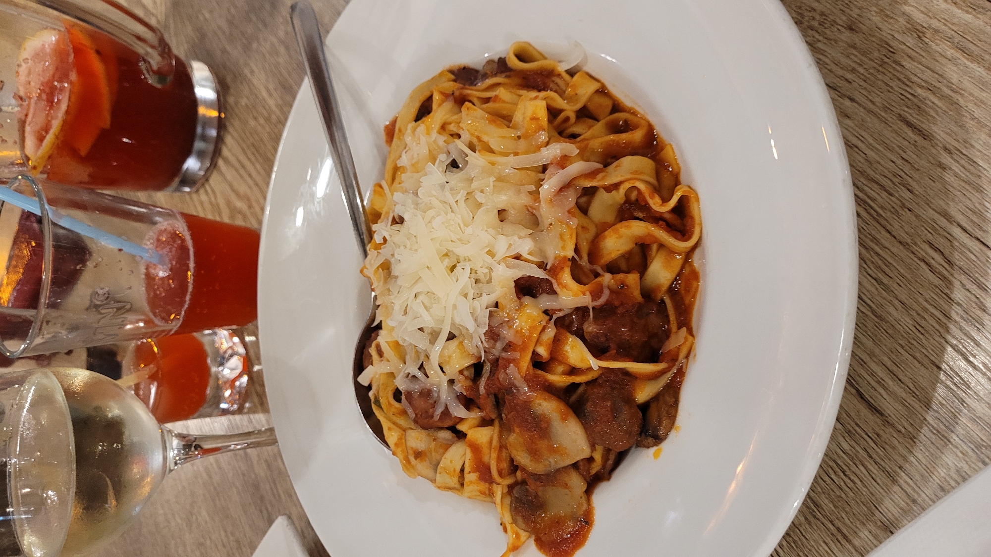 Diners document pasta and pizza meals in Varna restaurant