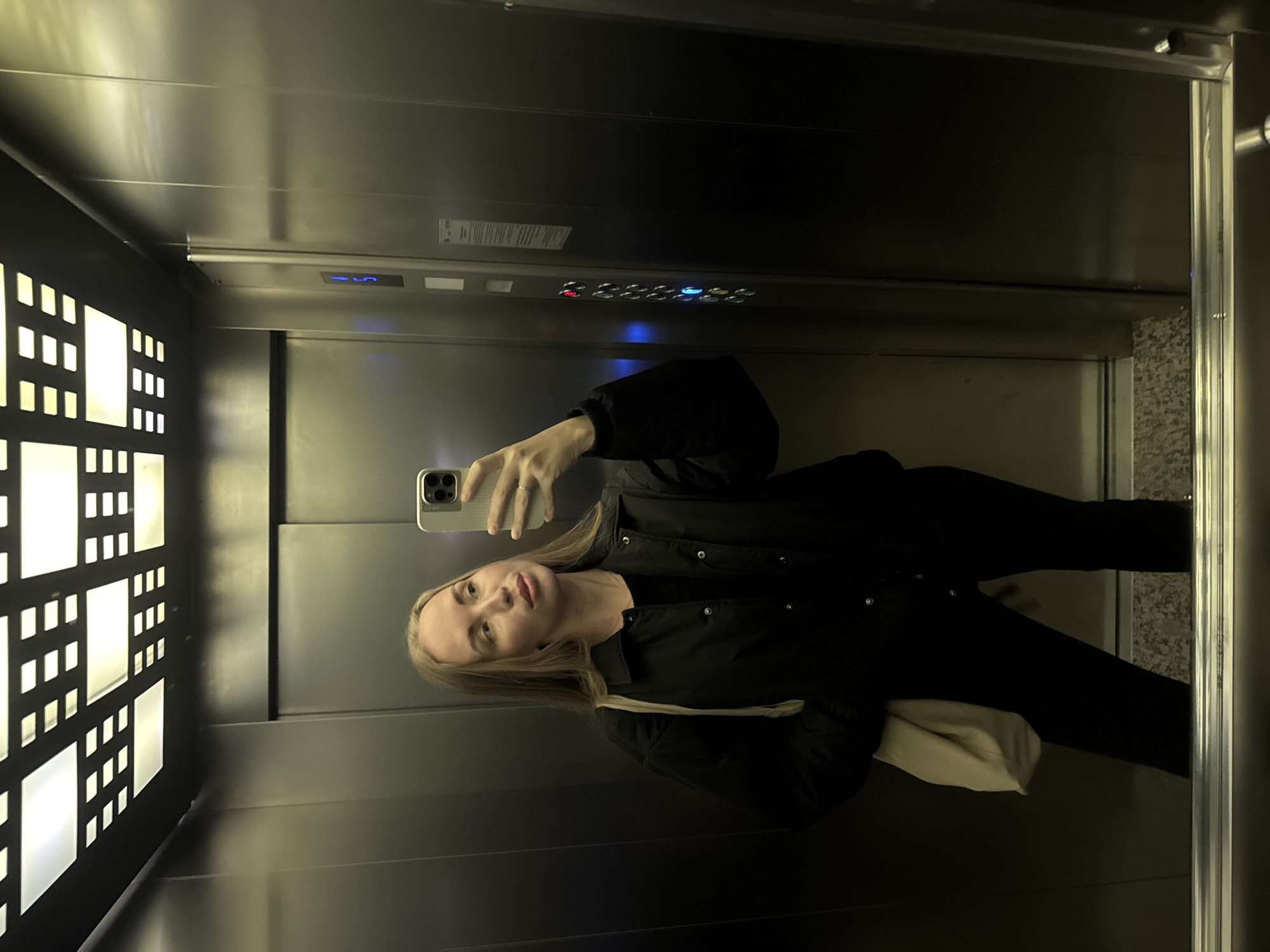 Morning moments captured in Sirius: elevator selfie, sleeping cat