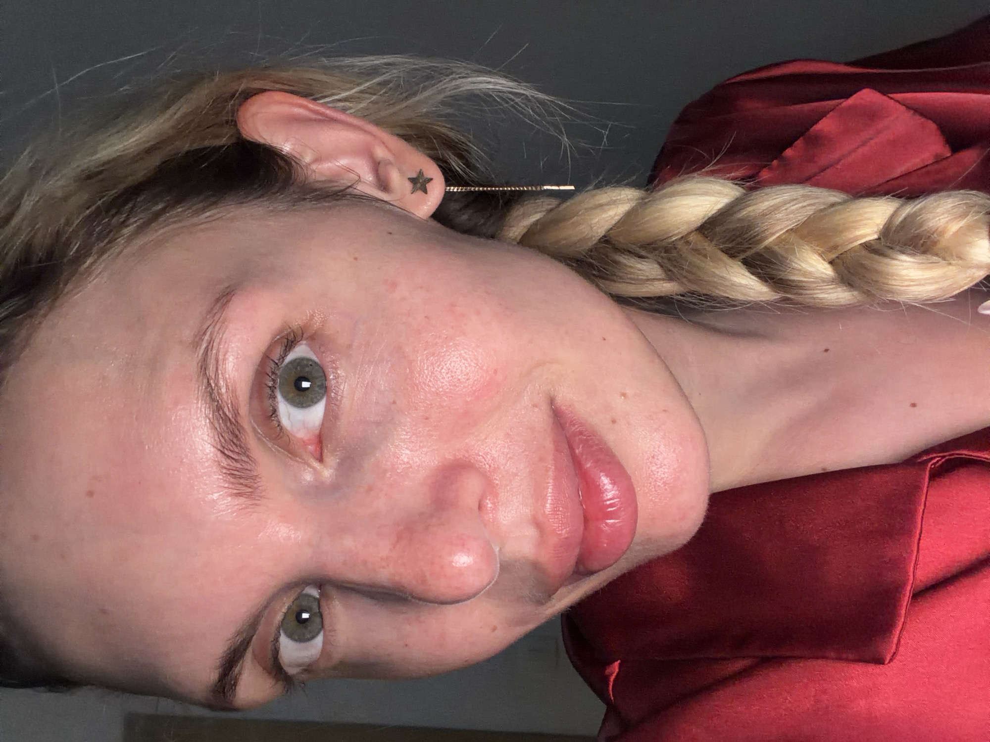 Woman applies skincare routine in Budva Montenegro evening
