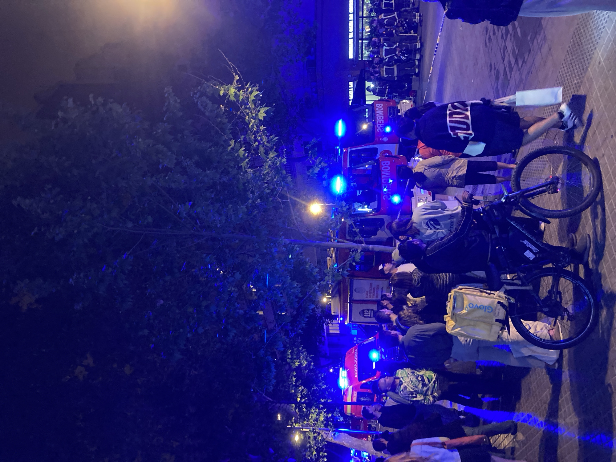 Fire trucks respond to nighttime urban emergency incident