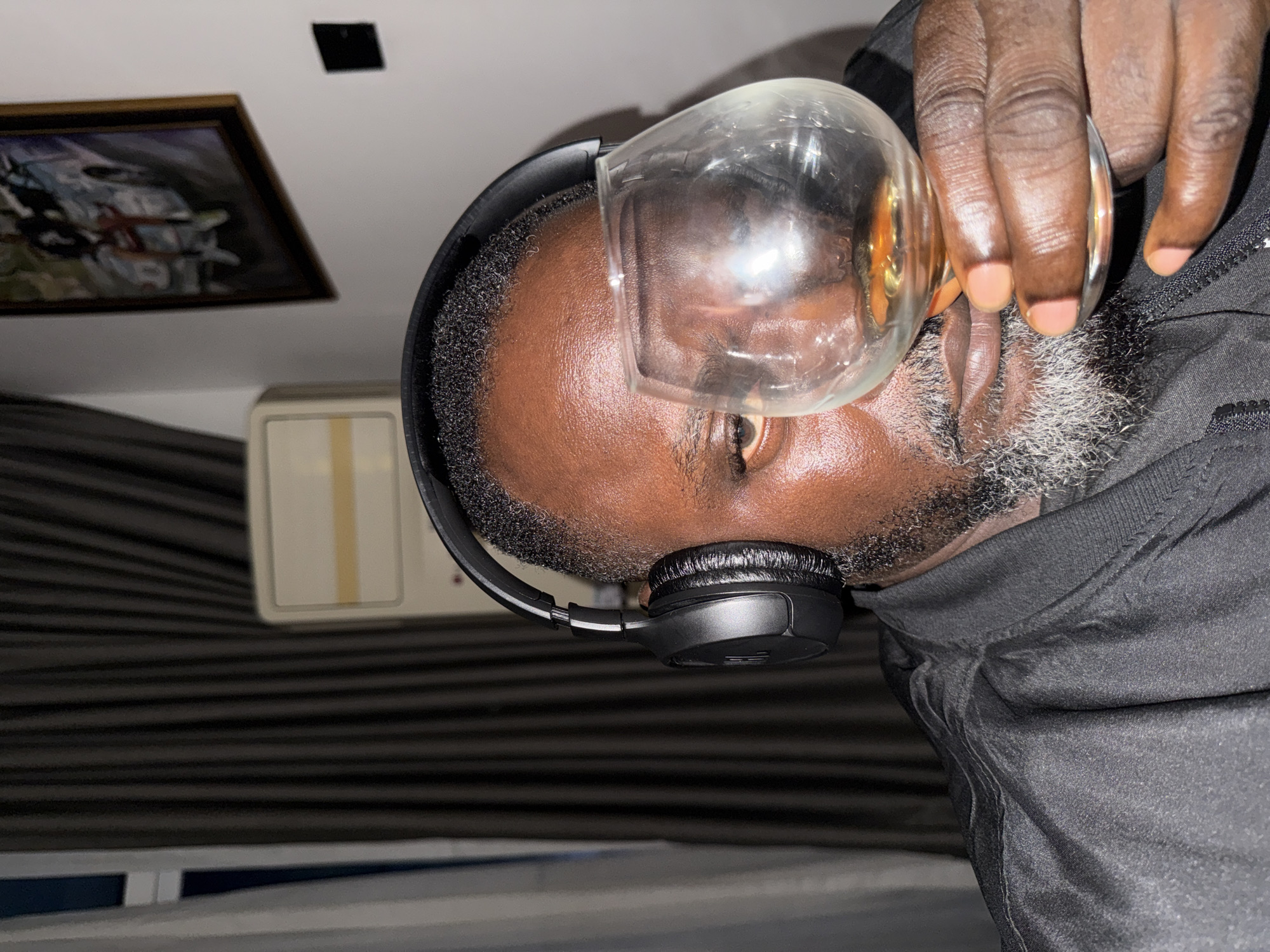 Headphones on, brandy in hand, chilling in Igboefon