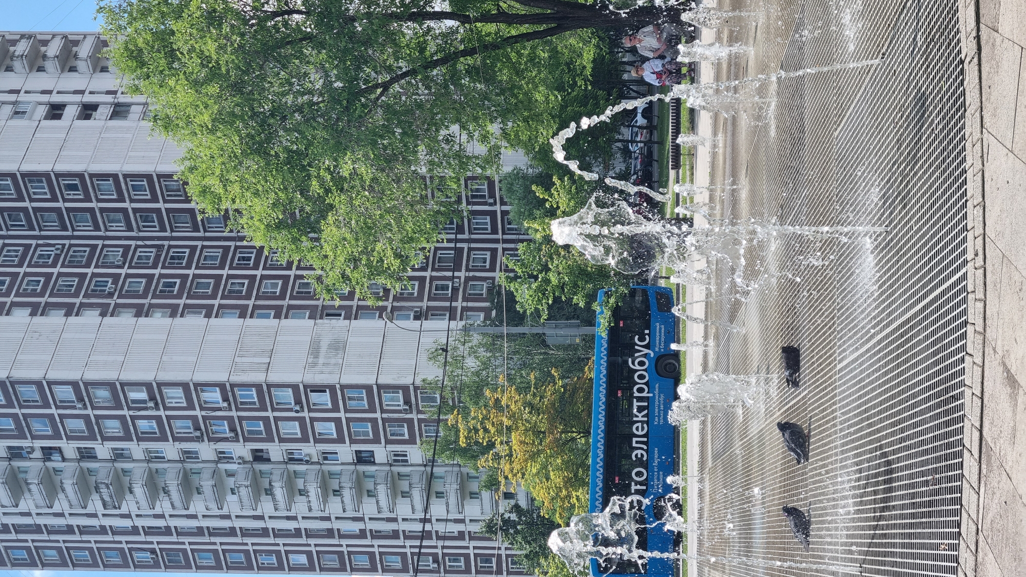 Summer morning scenes across a Moscow residential neighborhood