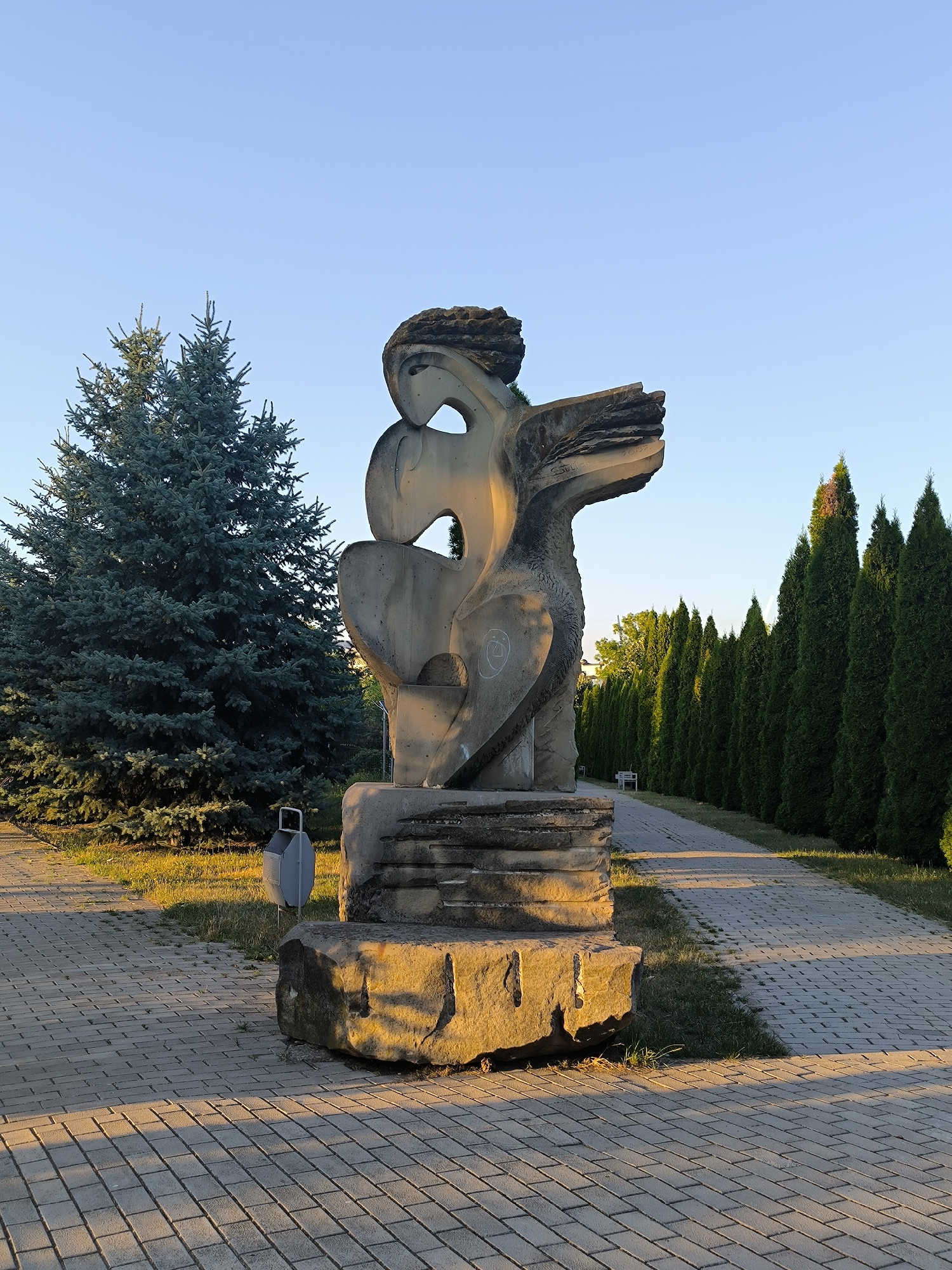 Sculptures and fountains in a Chișinău park at golden hour