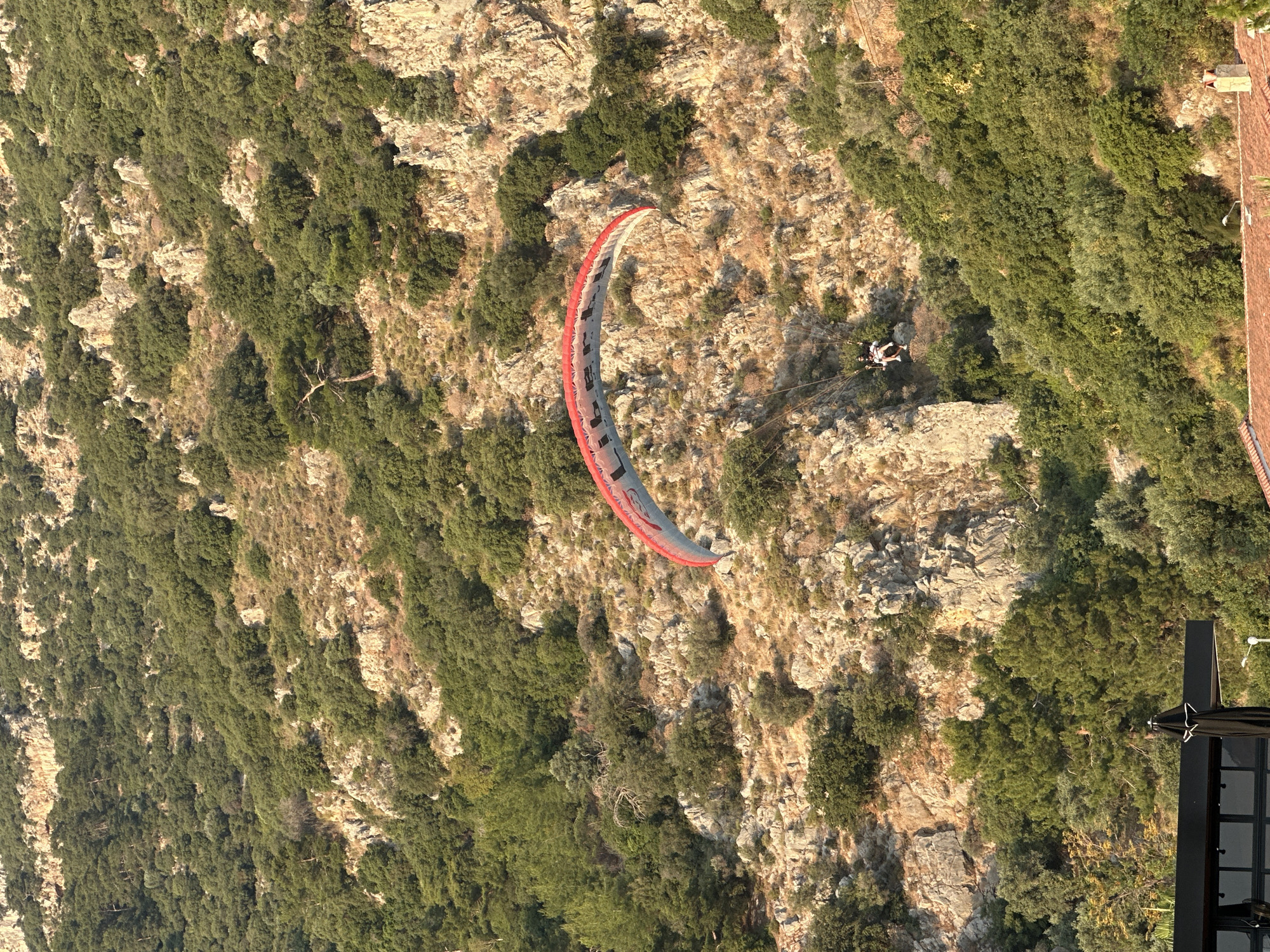 Paragliders descend over Fethiye beaches during golden hour activities