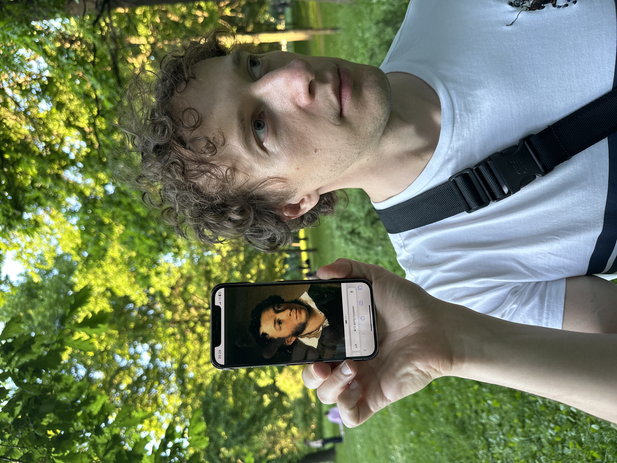 Man in white t-shirt observed outdoors in Saint Petersburg