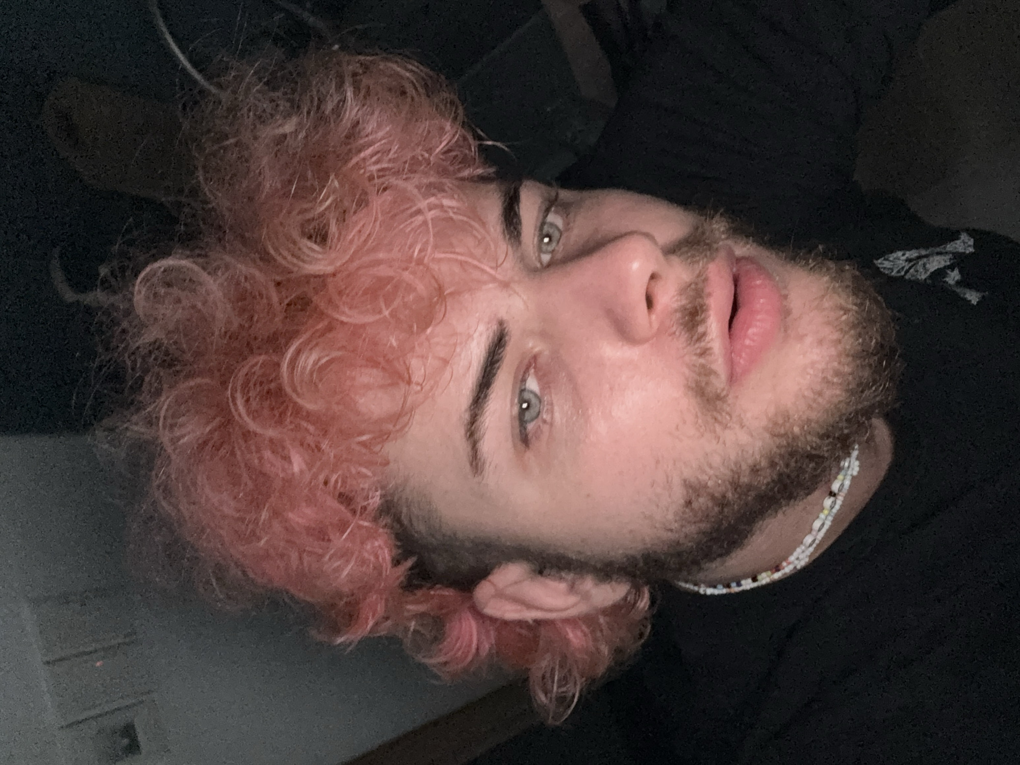 Pink-haired person photographed repeatedly with toys in Đà Nẵng