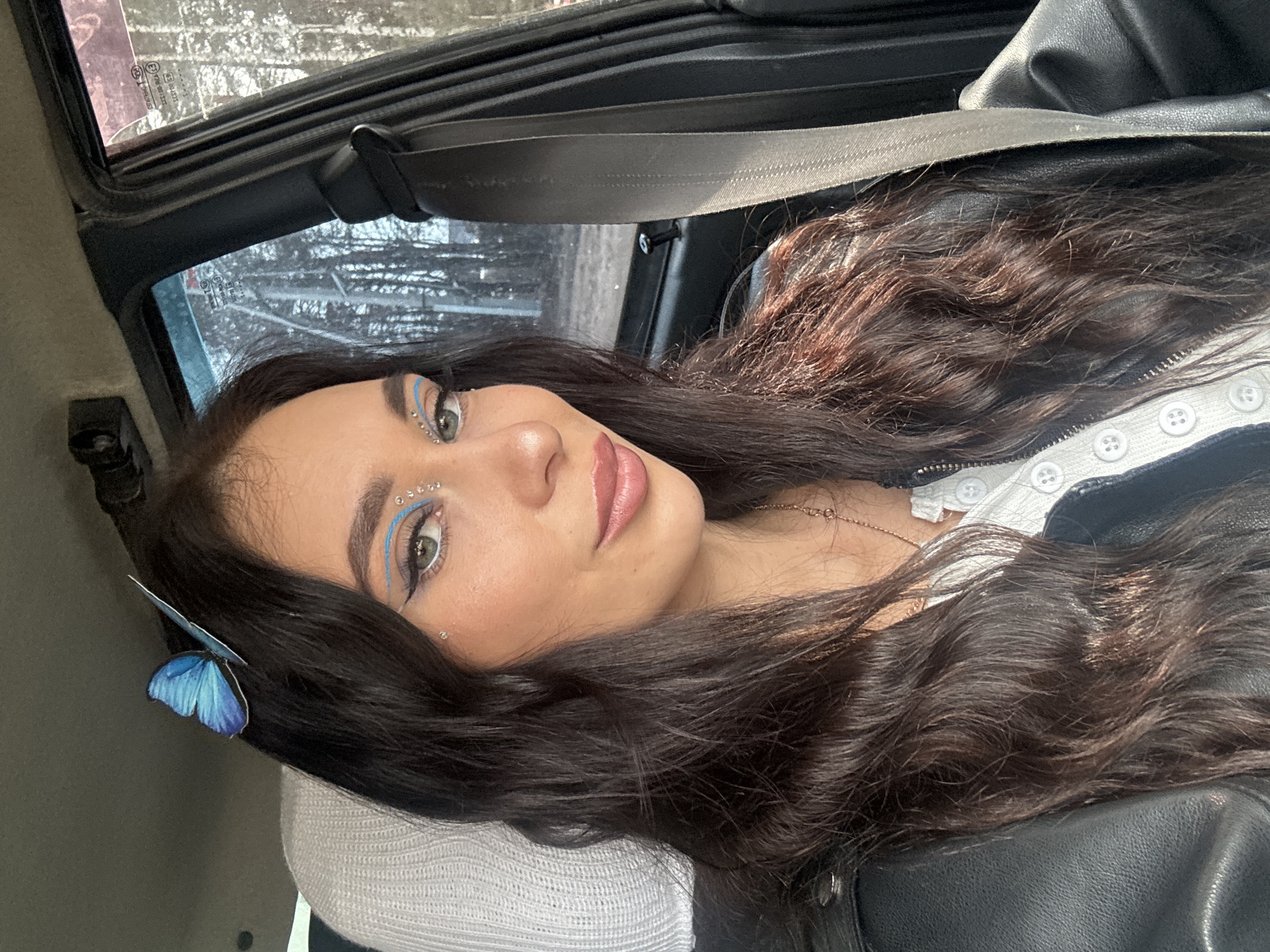 Woman photographed in car, indoors in Chaikovsky, Russia