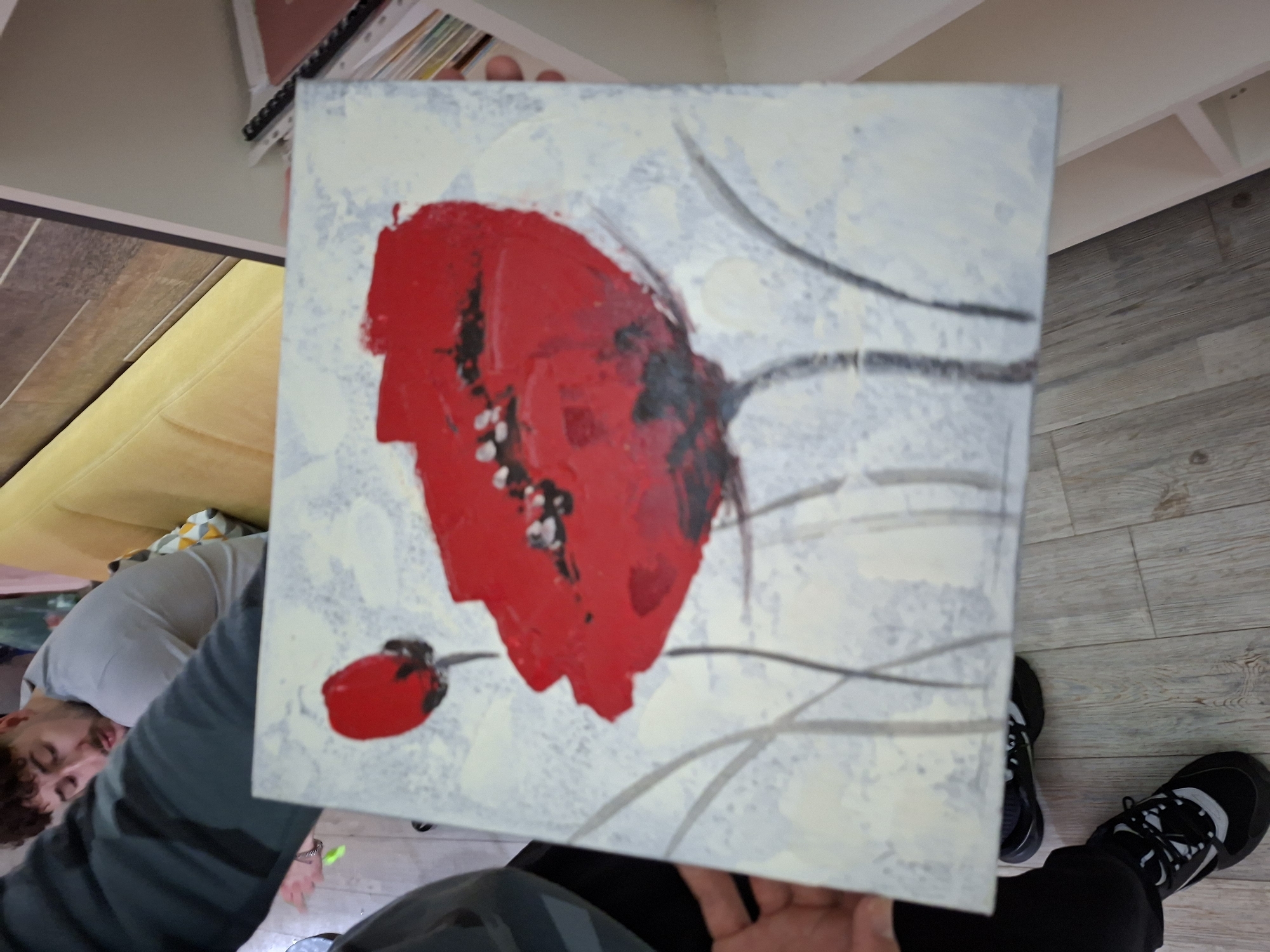 Person displays artwork and decorations at Nova Zagora residence