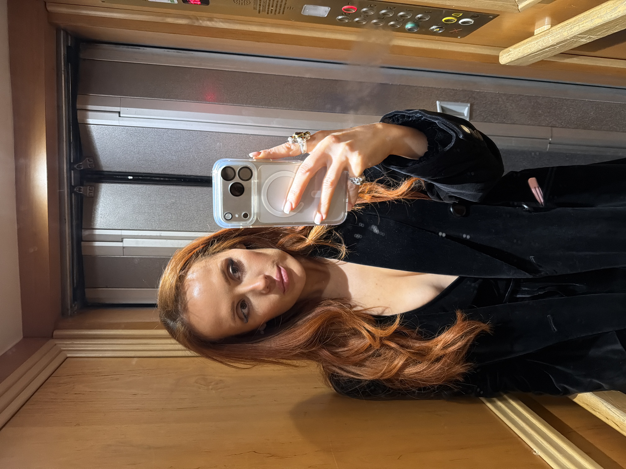 Woman takes elevator selfie in Paris early morning