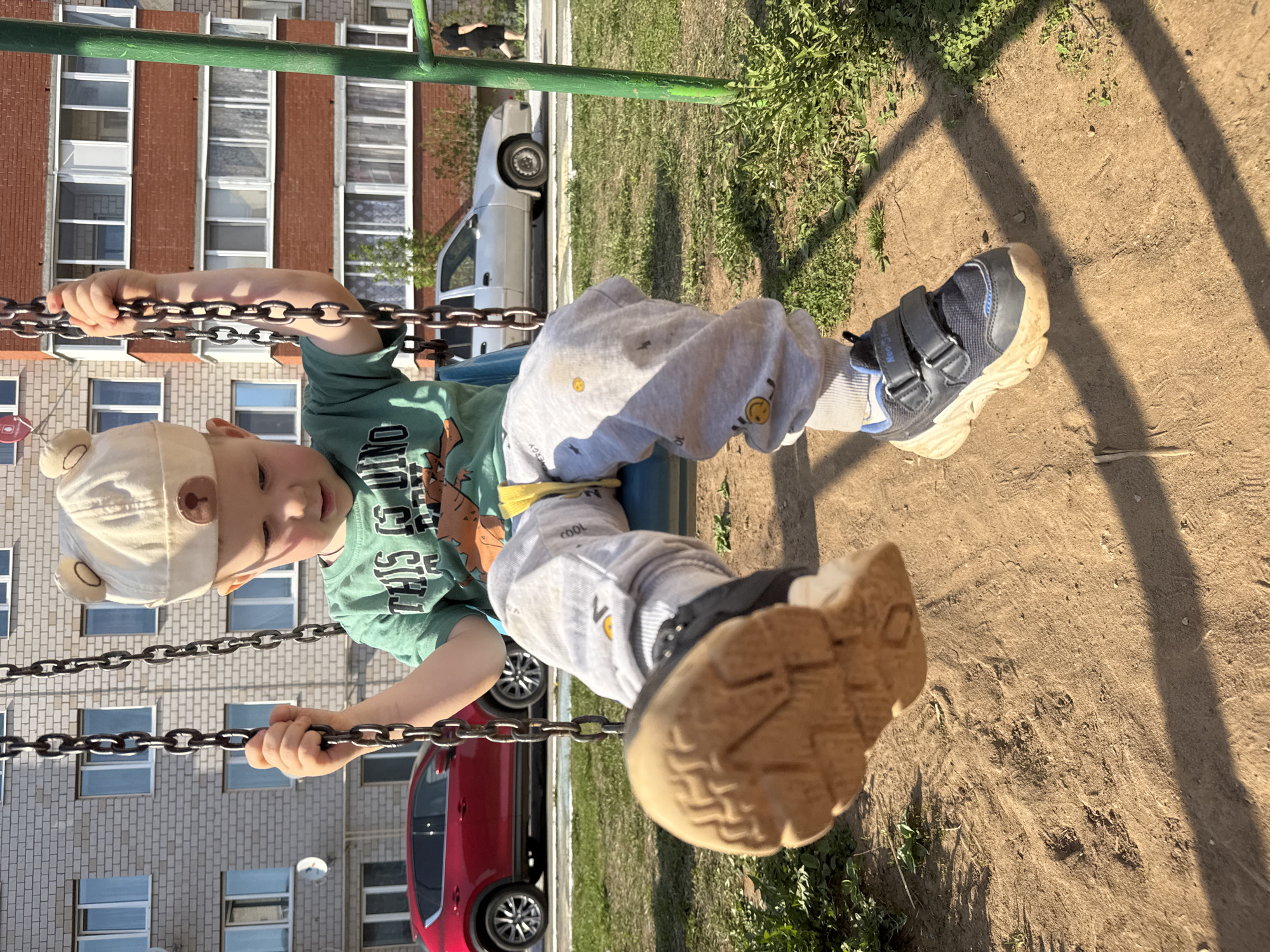 Mother and child enjoy spring afternoon at Russian playground