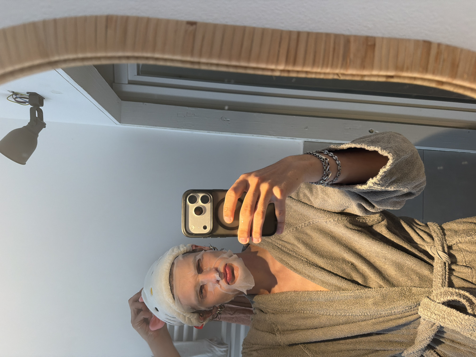 Milan resident takes masked mirror selfie wearing cat ears