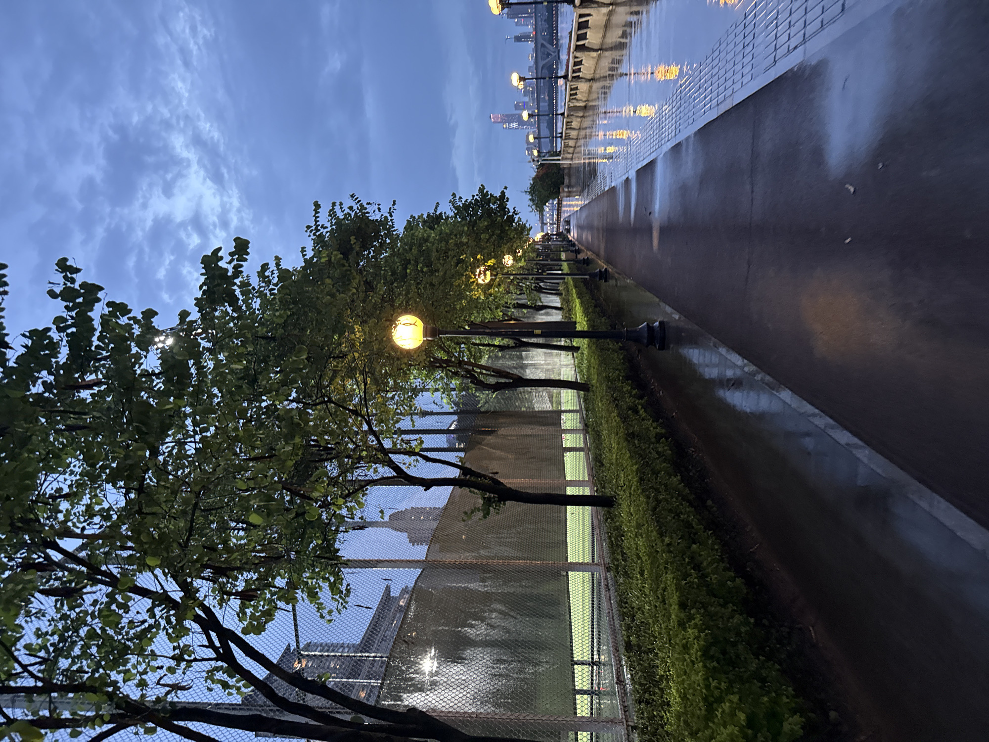 Rainy dusk along Haizhu's Pearl River waterfront promenade