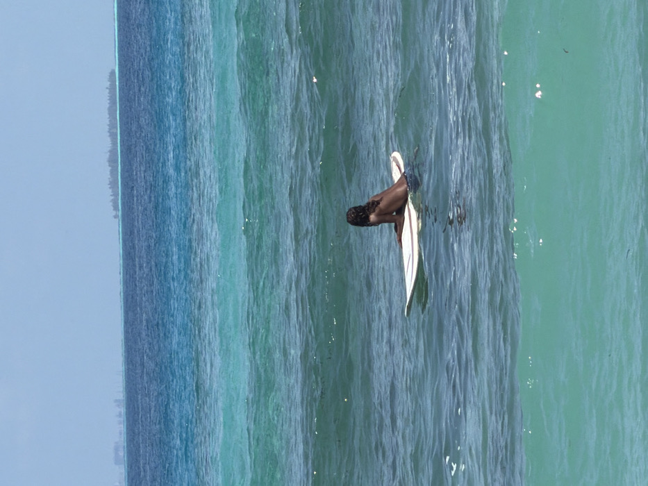Morning surf session and beach activities in Maafushi, Maldives