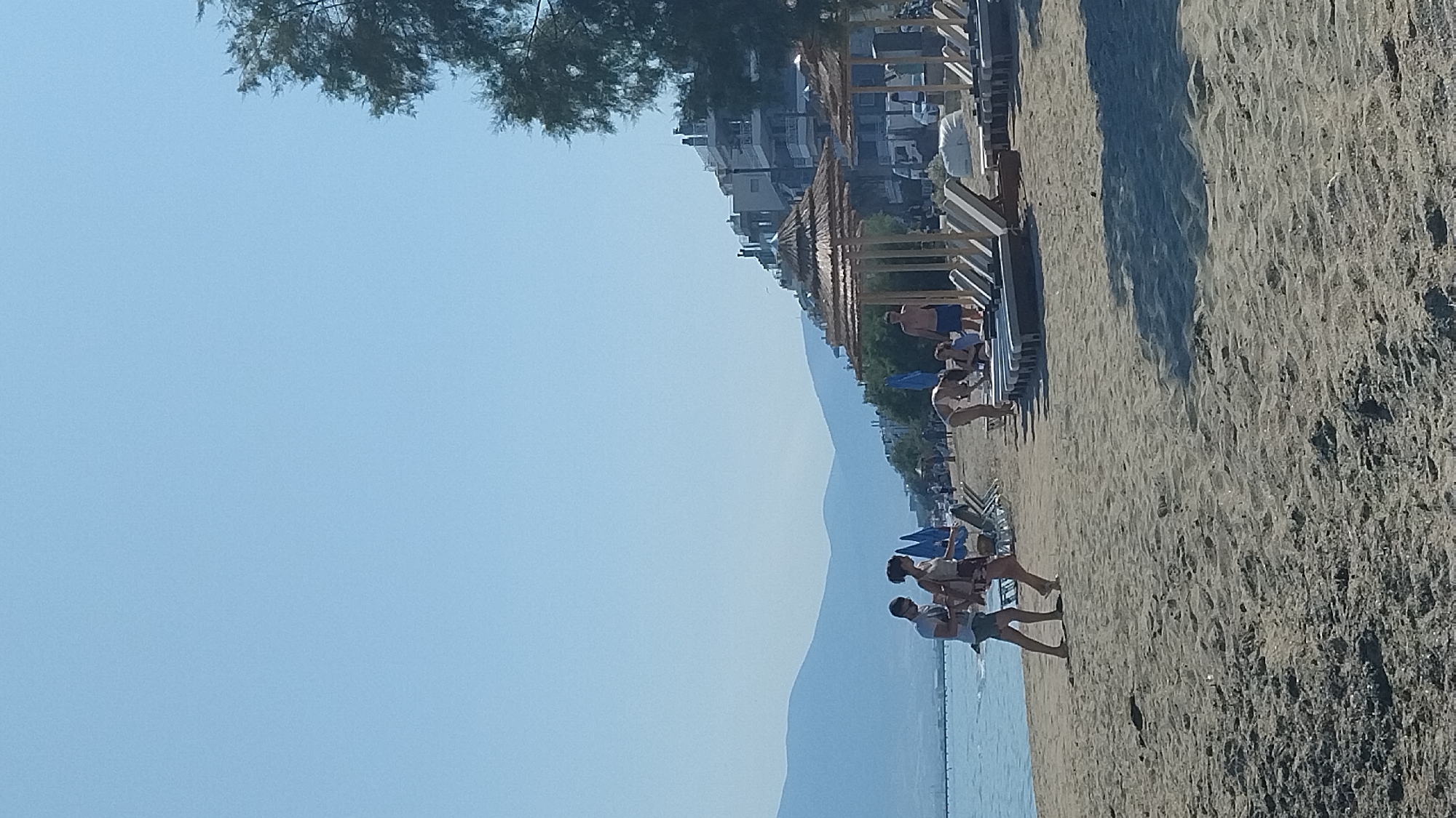 Beach flat-lay shoot with jewelry and beauty products, Thessaloniki coast