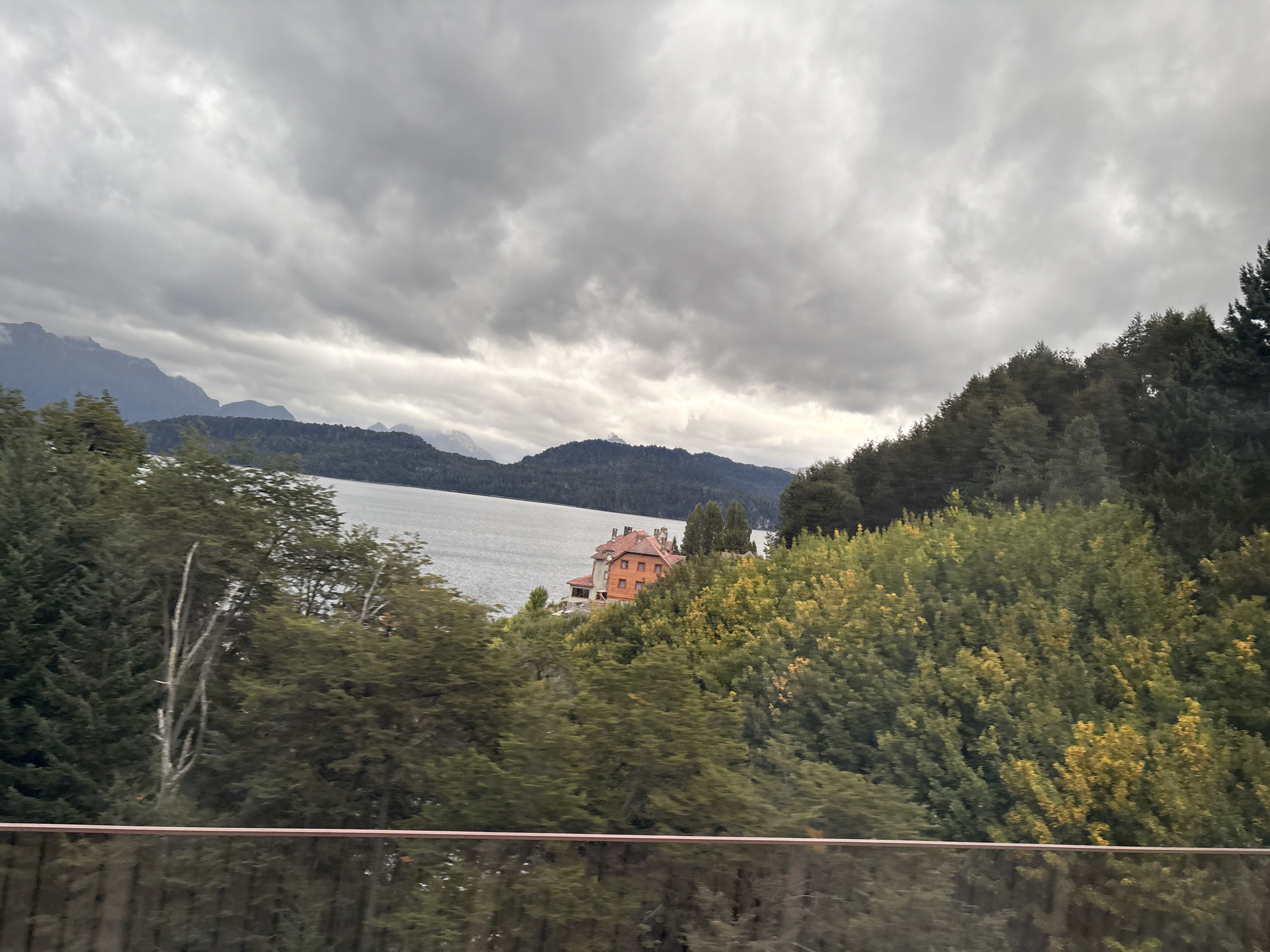 Gray clouds cover Villa La Angostura lake and mountains