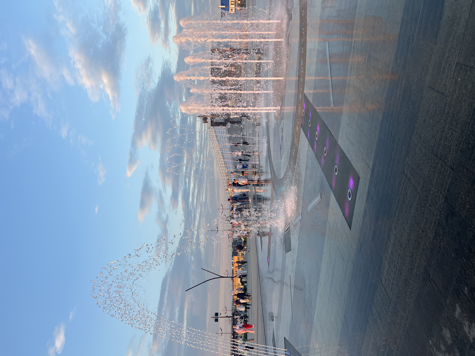Summer evening at Magnitogorsk's fountain plaza