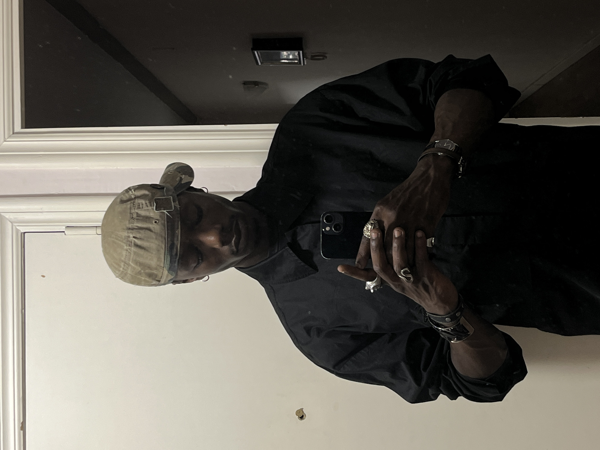 Person takes multiple mirror selfies in Barcelona apartment