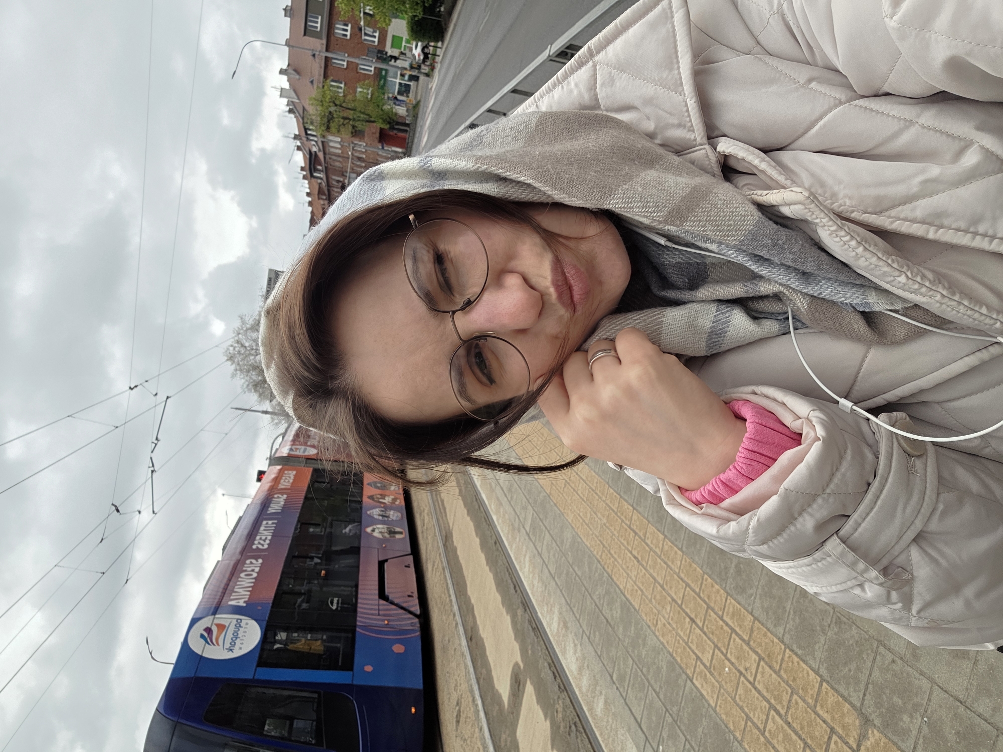 Woman photographed in urban Wrocław on overcast morning