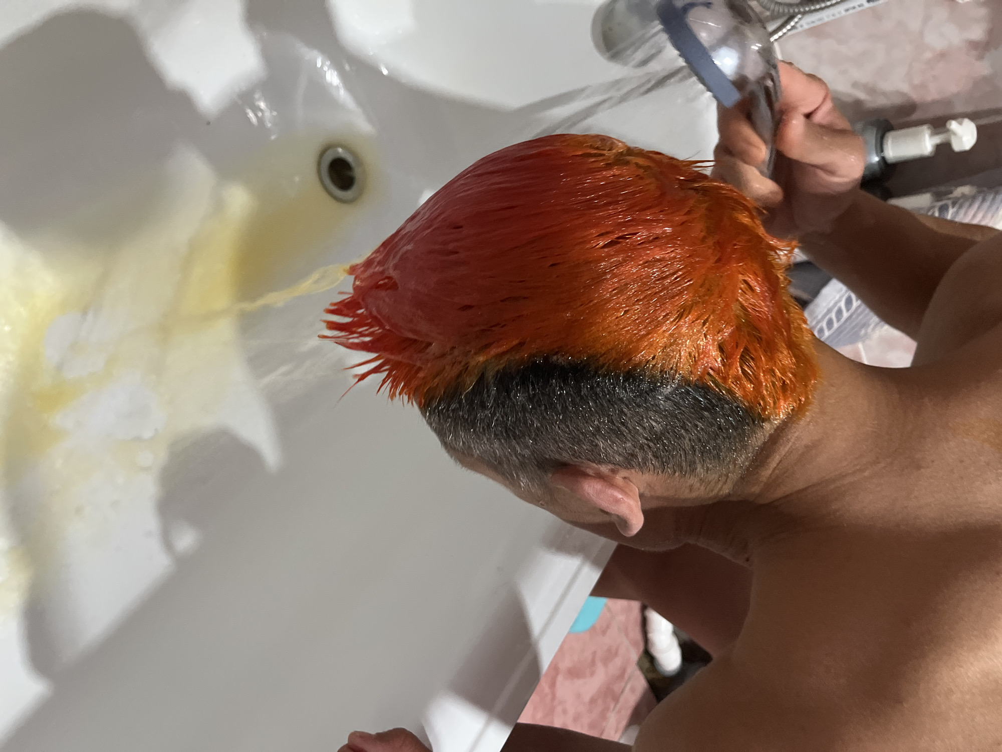 Person documents orange hair dye transformation in Chaikovsky, Russia