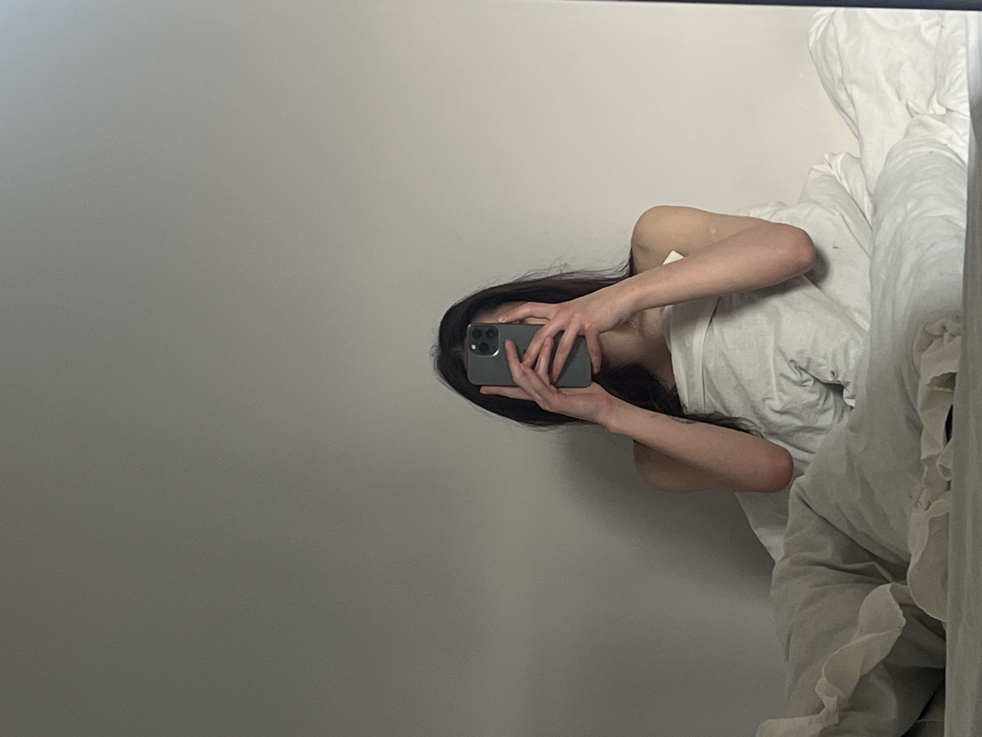 Person Takes Late Night Mirror Selfies in Ternopil Bedroom