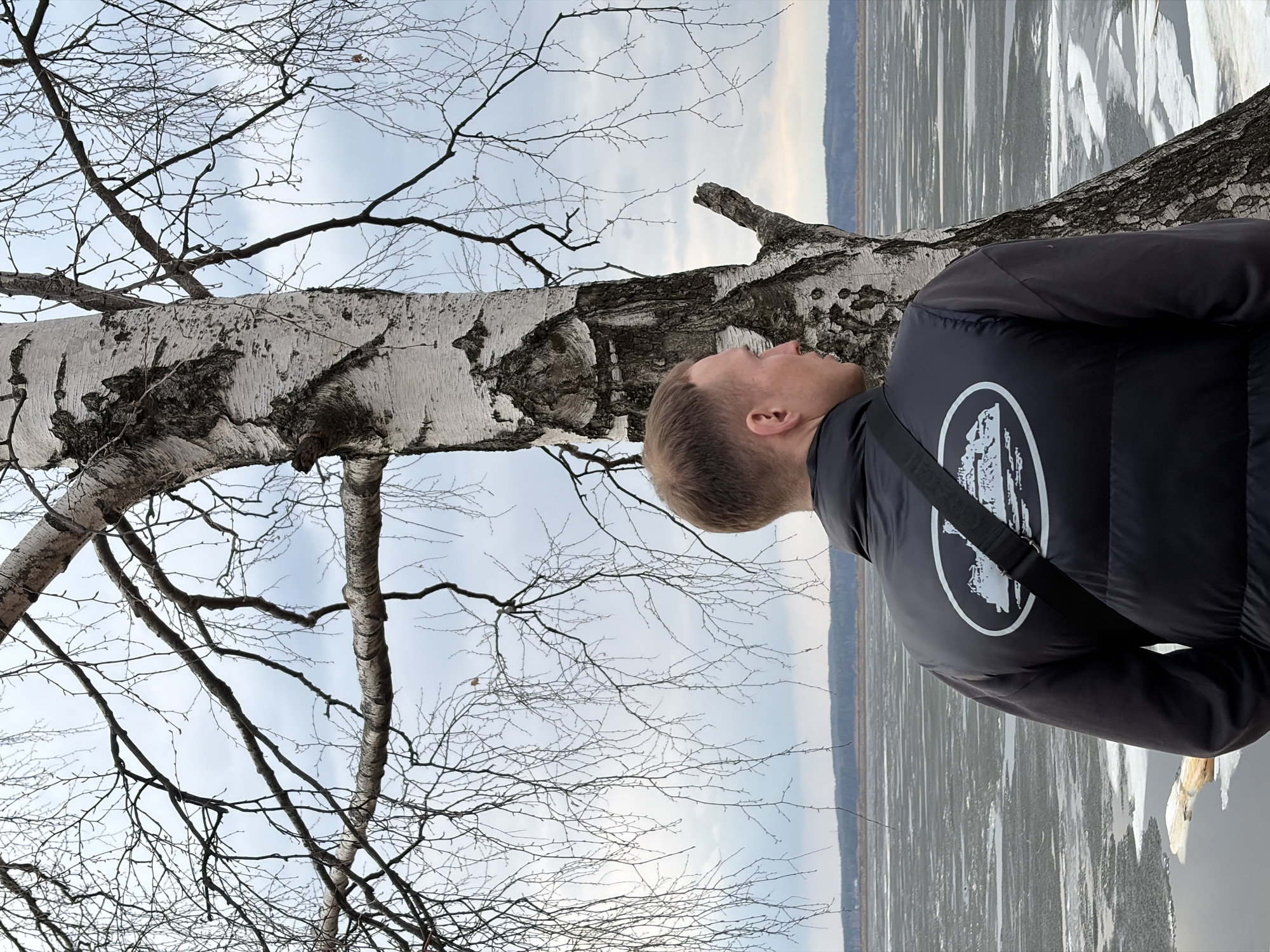 Spring day activities along frozen Kama River in Chaikovsky