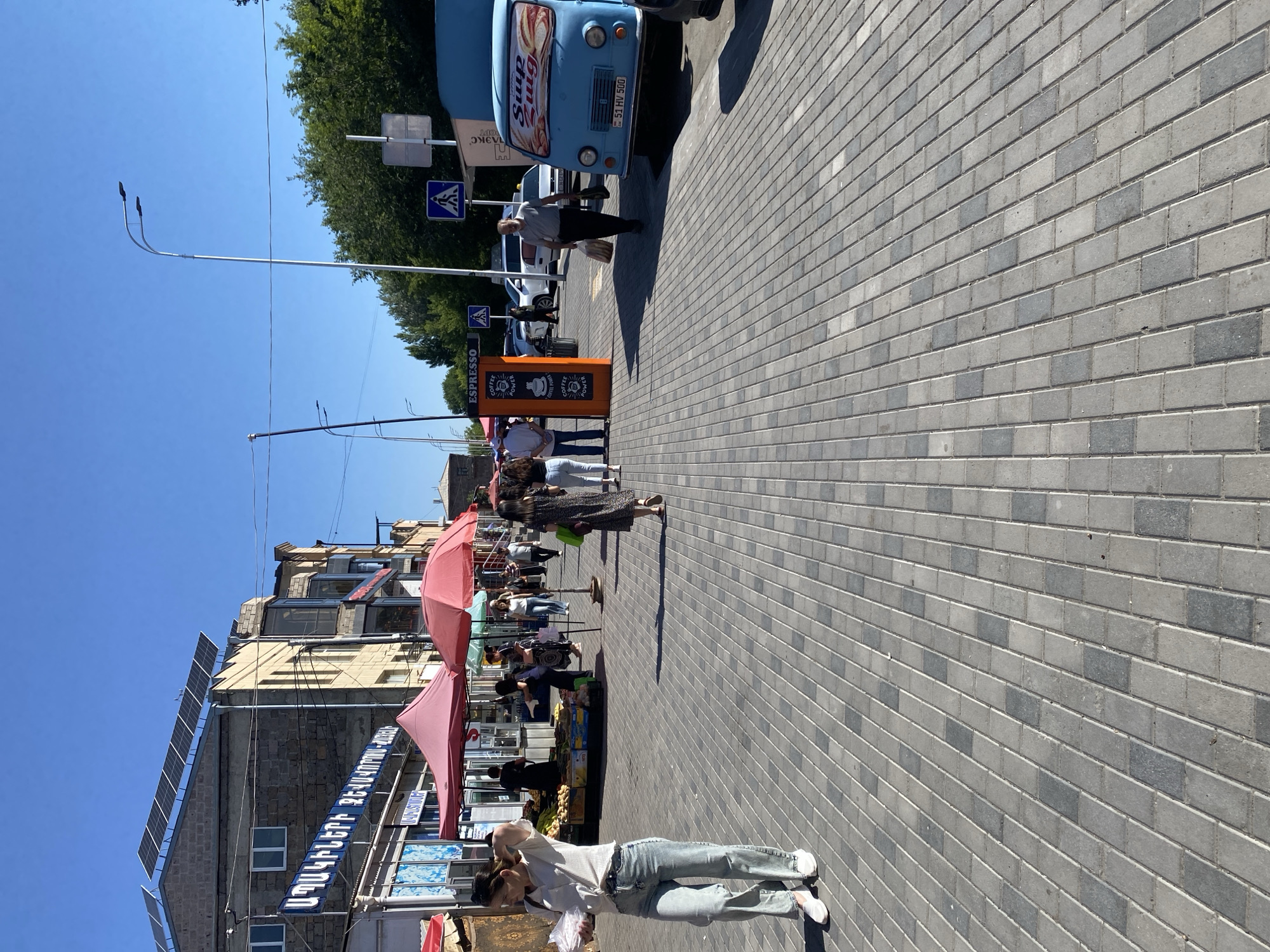 Morning market activity in Gyumri — produce, bread, and coffee roasting