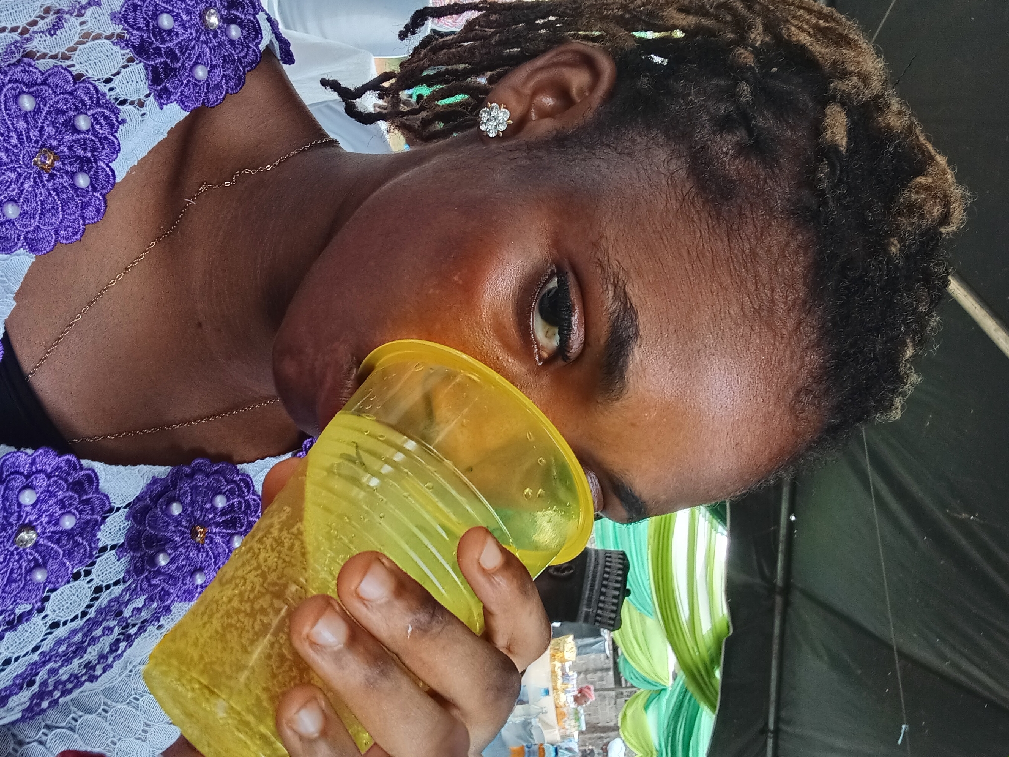 Woman dines on rice and meat in Shagamu, Nigeria
