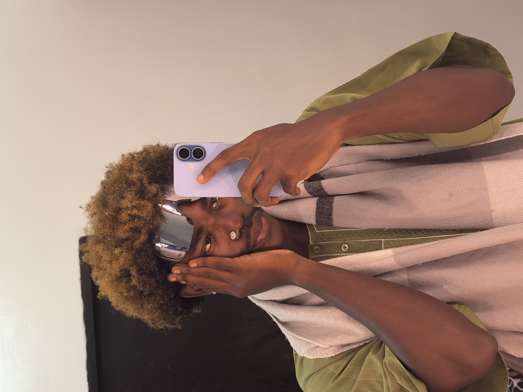 Person takes mirror selfies indoors in Igboefon, Nigeria