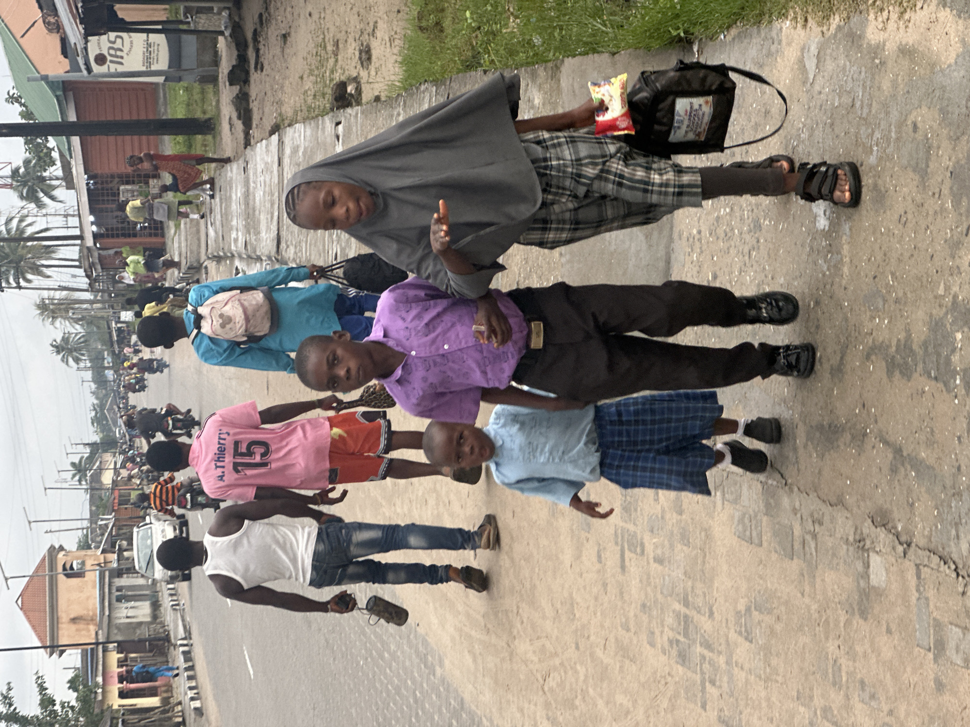 Morning foot traffic along a Badagry street