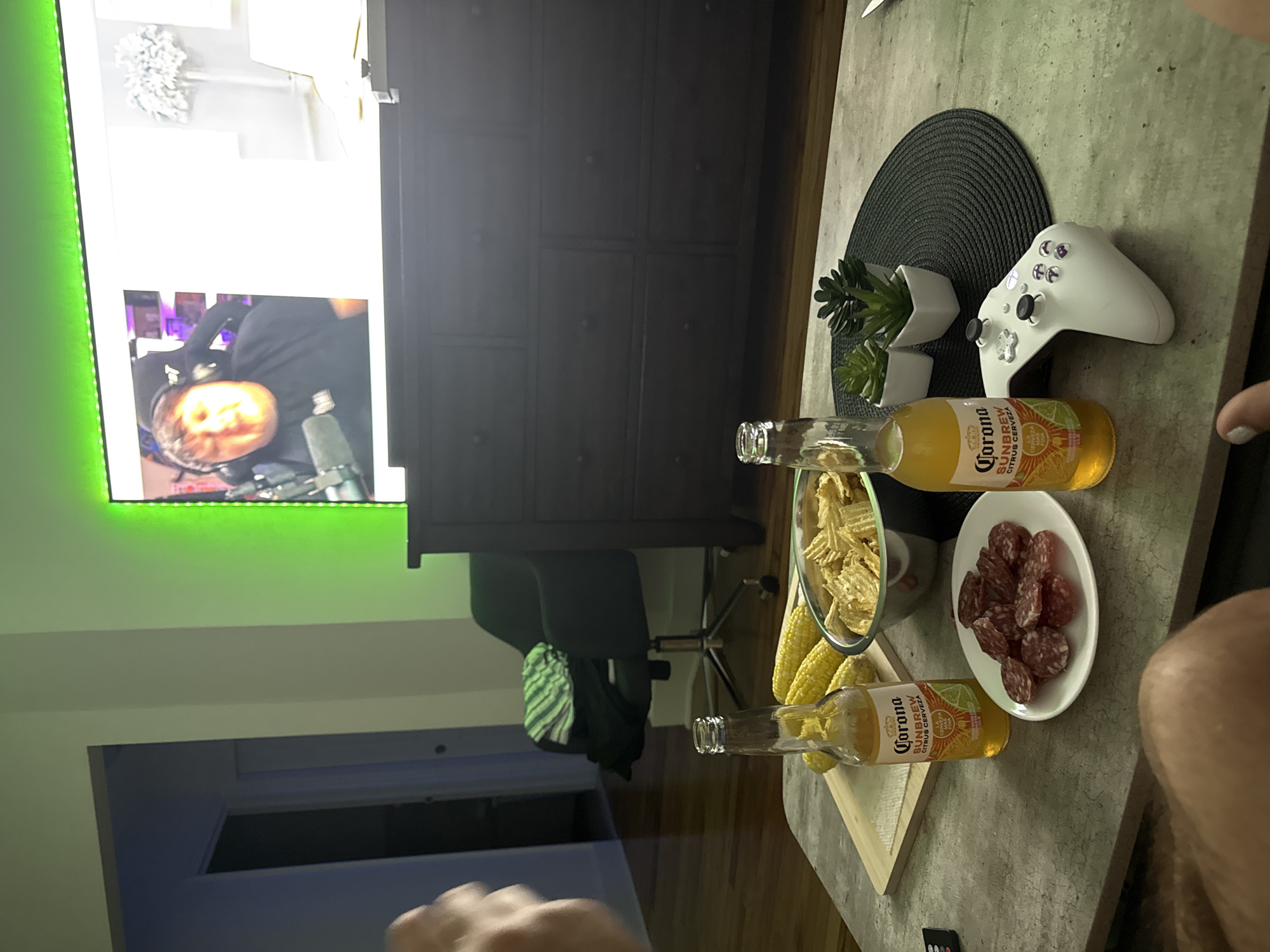 Late-night apartment hangout with snacks, drinks, and a livestream