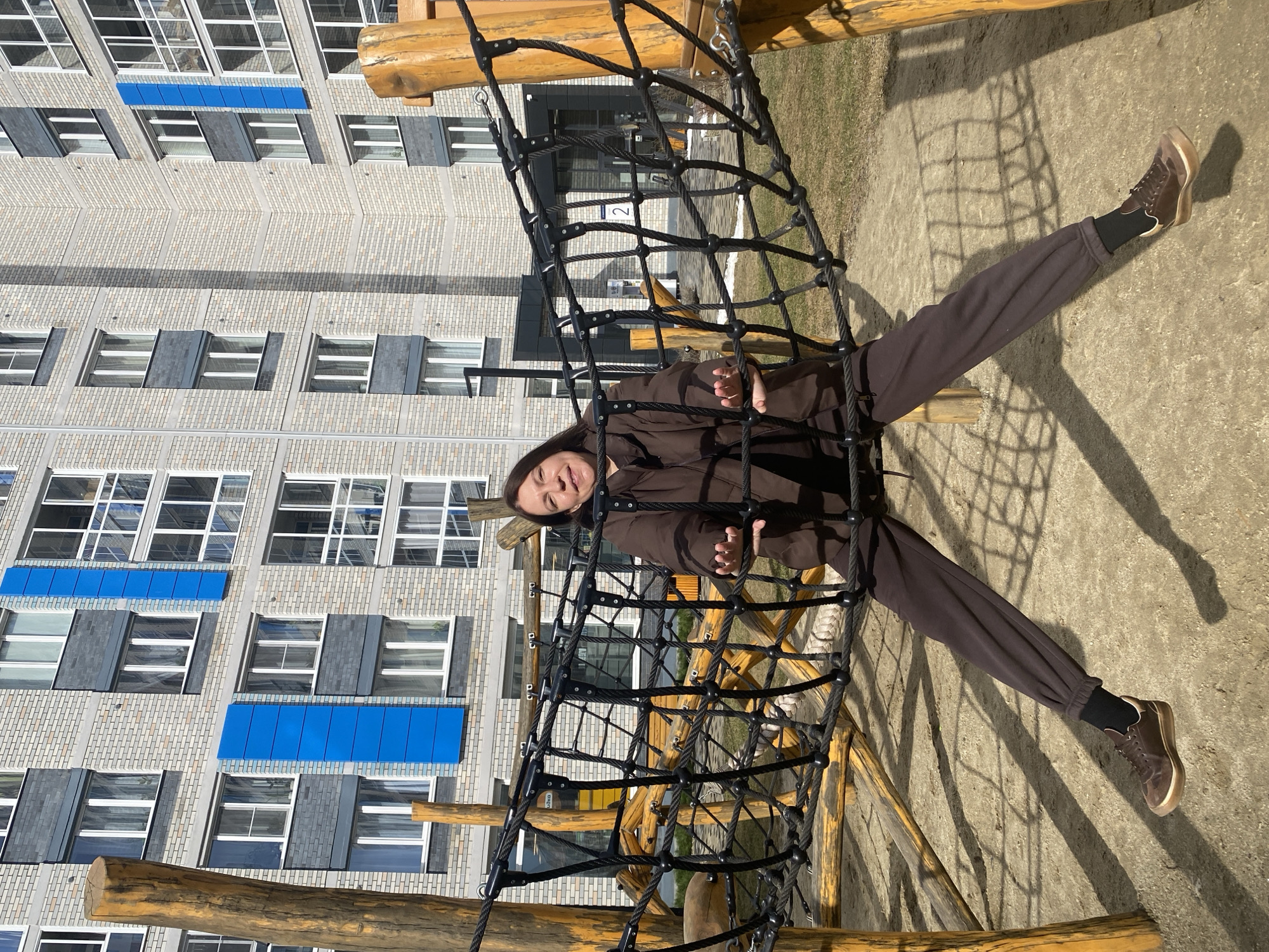 Woman uses playground equipment during early morning in Yekaterinburg